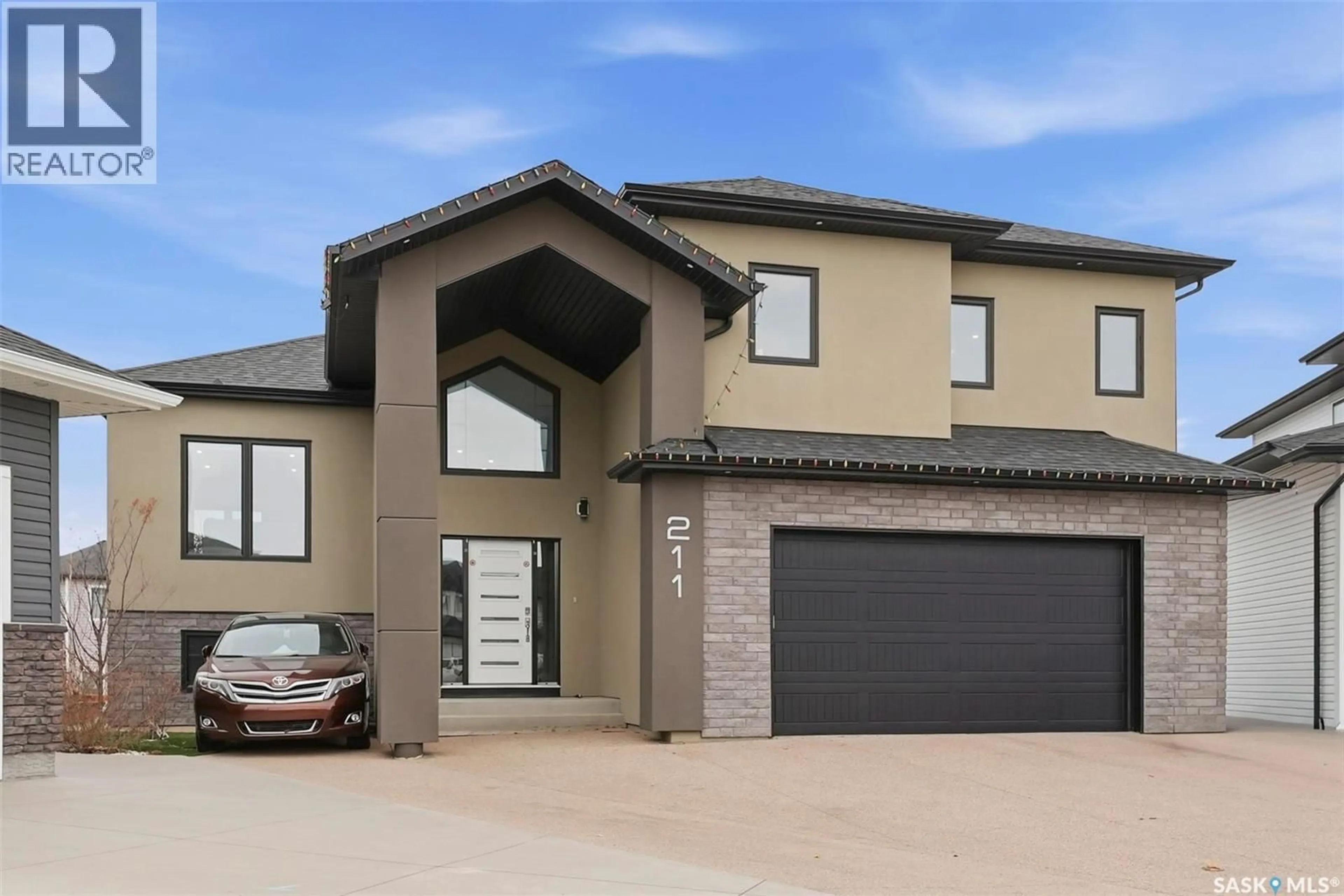 Home with brick exterior material, street for 211 BURGESS BAY, Saskatoon Saskatchewan S7V0S3