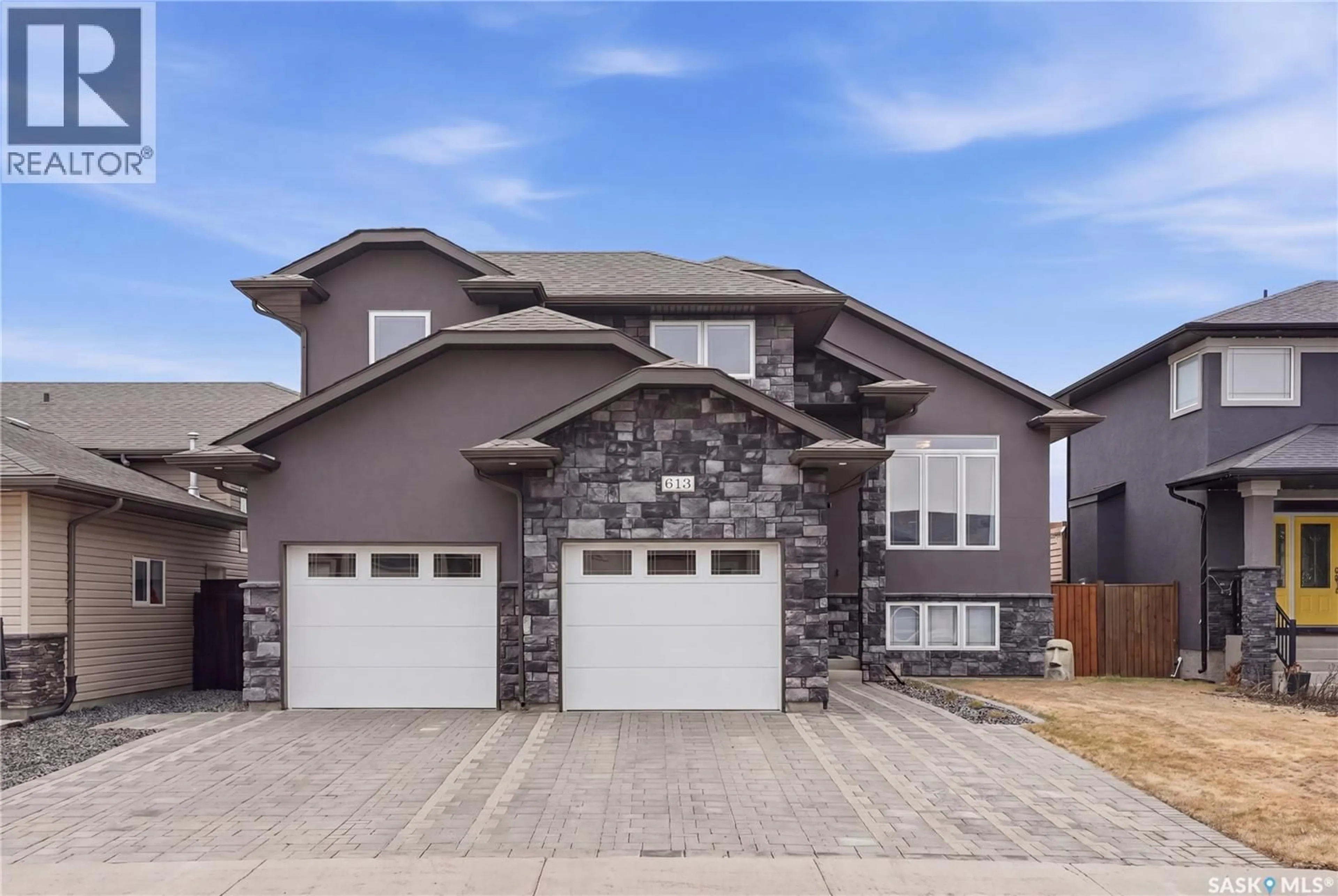 Home with brick exterior material, street for 613 REDWOOD CRESCENT, Warman Saskatchewan S0K4S2