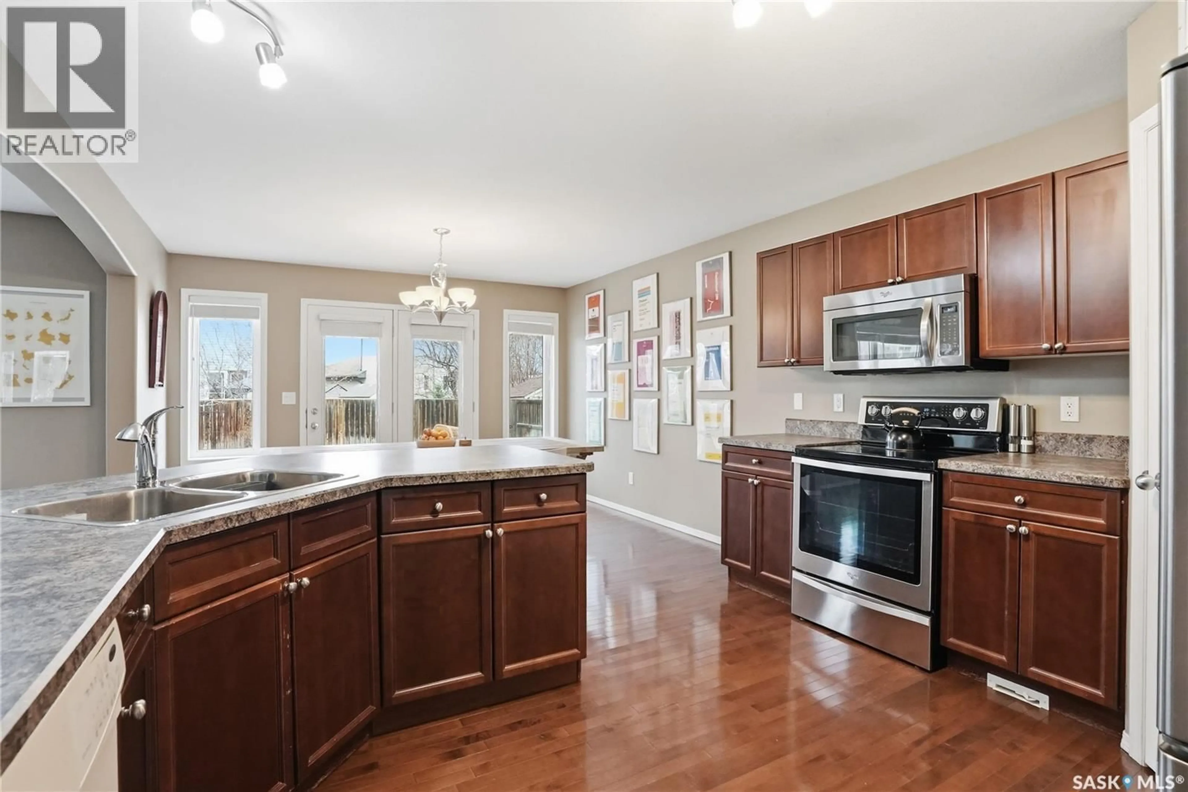 Open concept kitchen, ceramic/tile floor for 238 STEPNEY CRESCENT, Saskatoon Saskatchewan S7T0A1