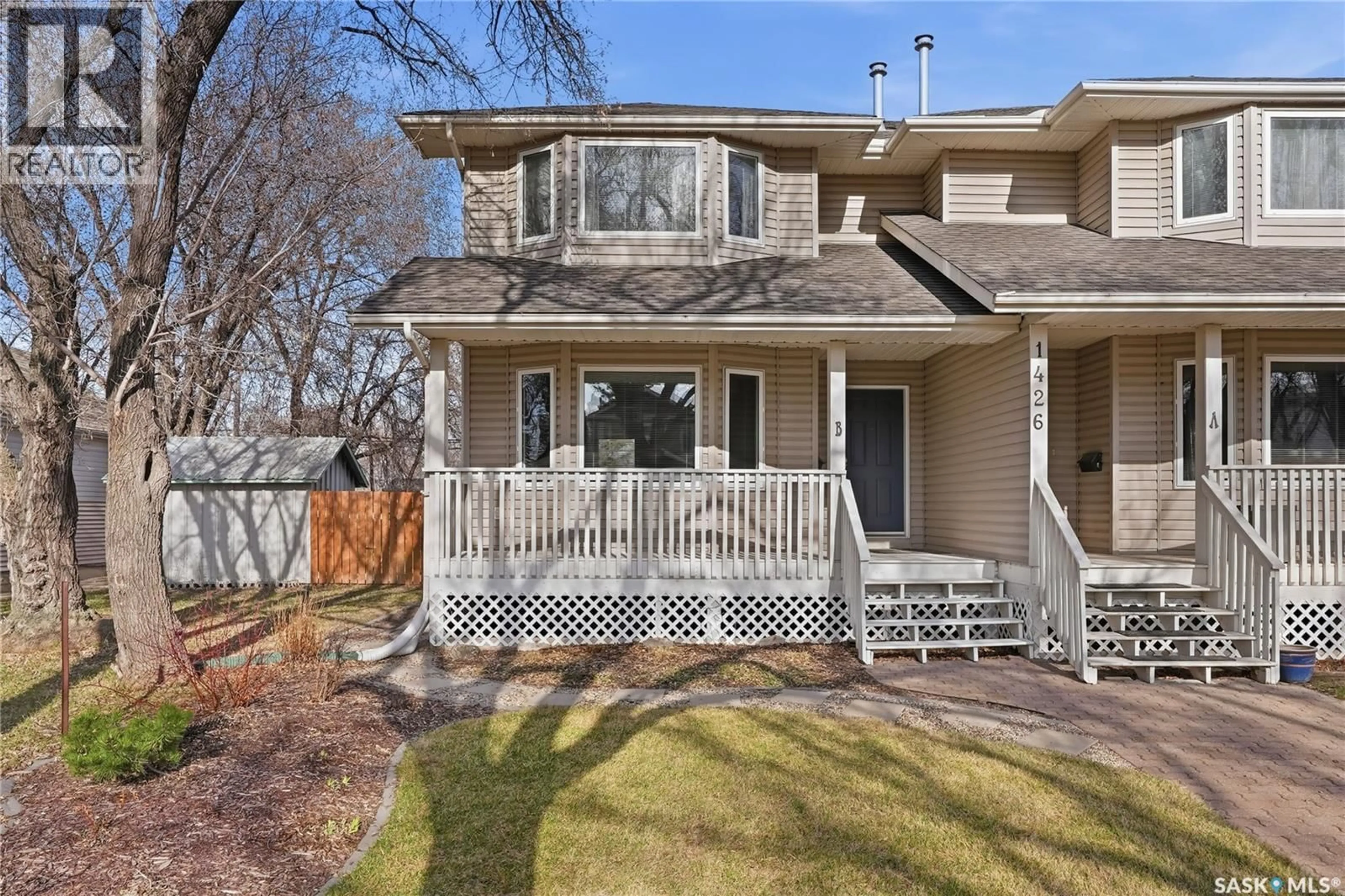 Home with vinyl exterior material, street for 1426B C AVENUE N, Saskatoon Saskatchewan S7K1L1
