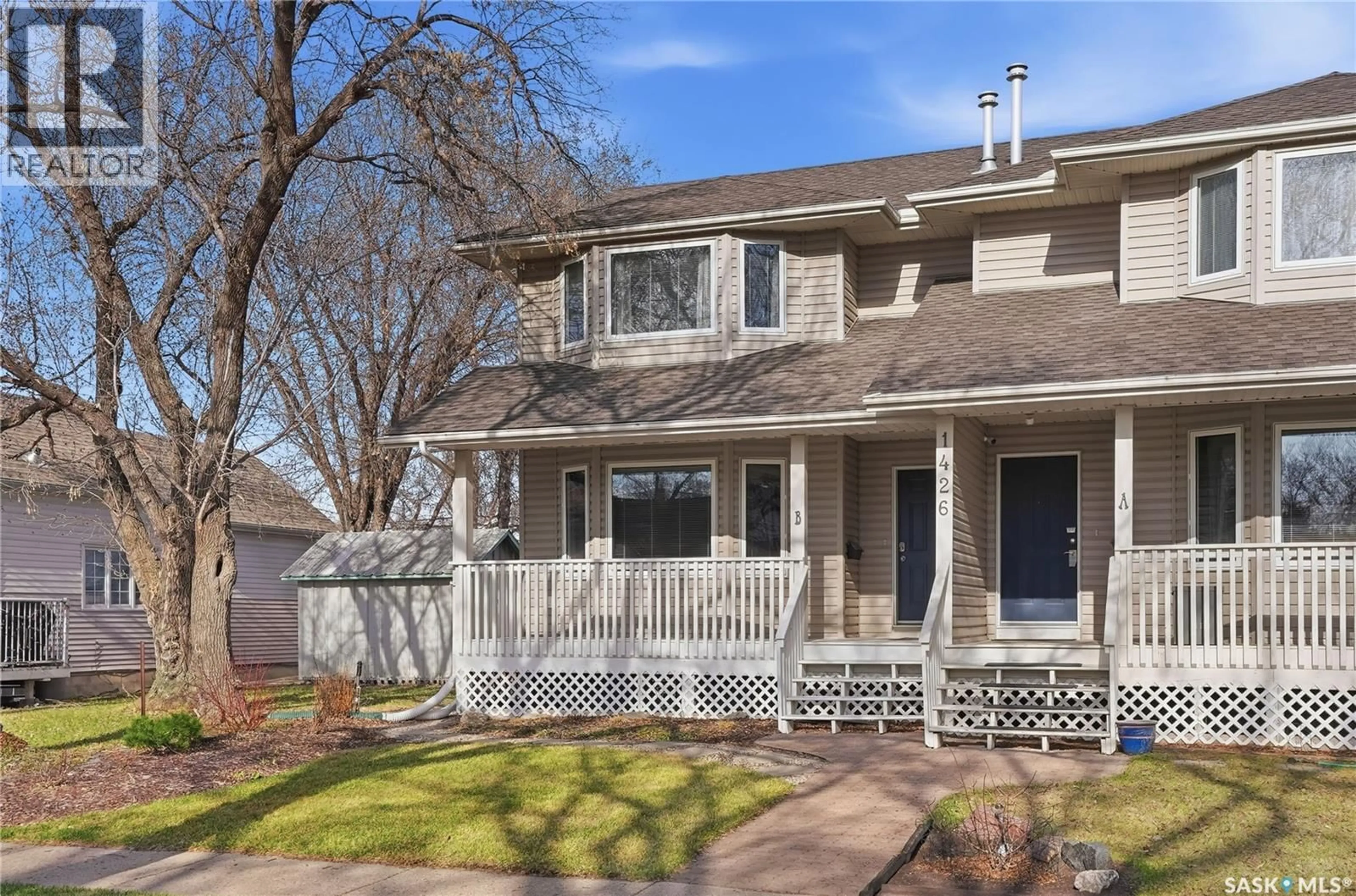 Home with vinyl exterior material, street for 1426B C AVENUE N, Saskatoon Saskatchewan S7K1L1