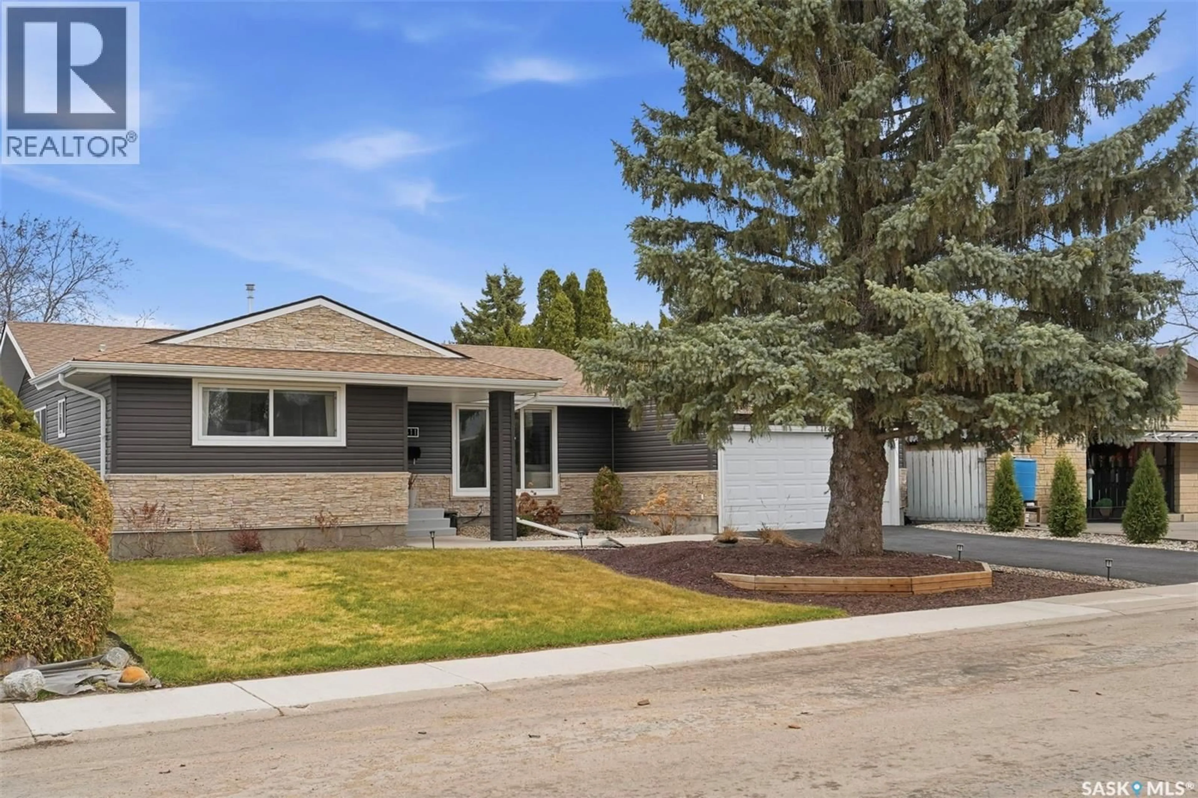 Home with brick exterior material, street for 411 AULD CRESCENT, Saskatoon Saskatchewan S7H4X2