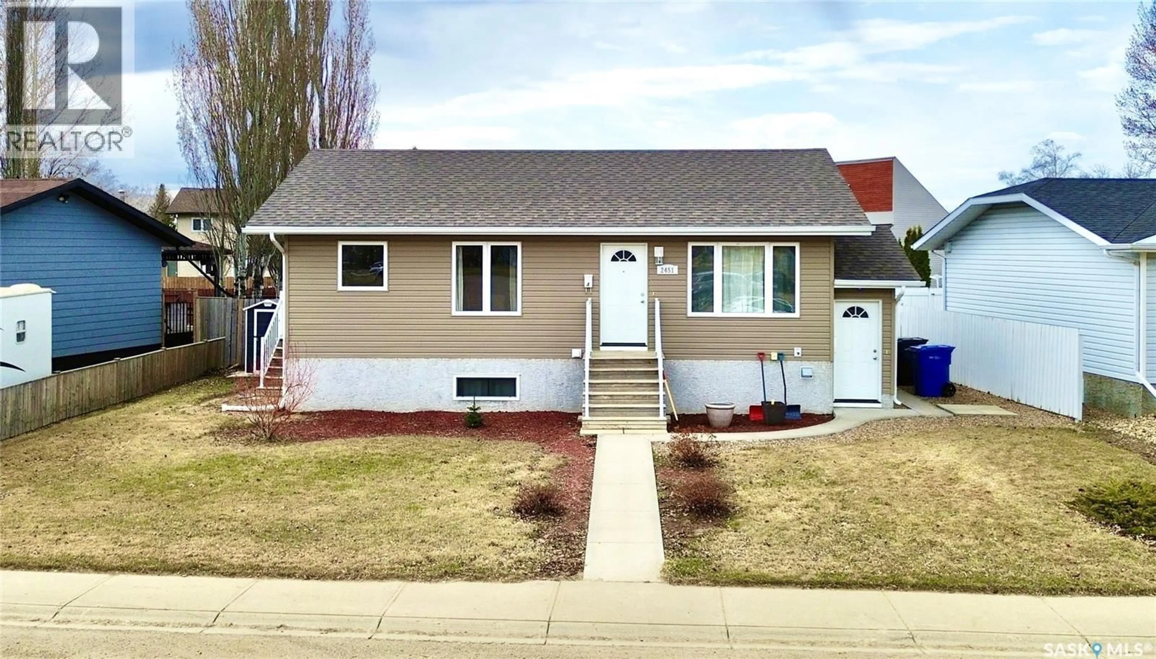 Home with vinyl exterior material, street for 2451 KILDEER DRIVE, North Battleford Saskatchewan S9A3T4