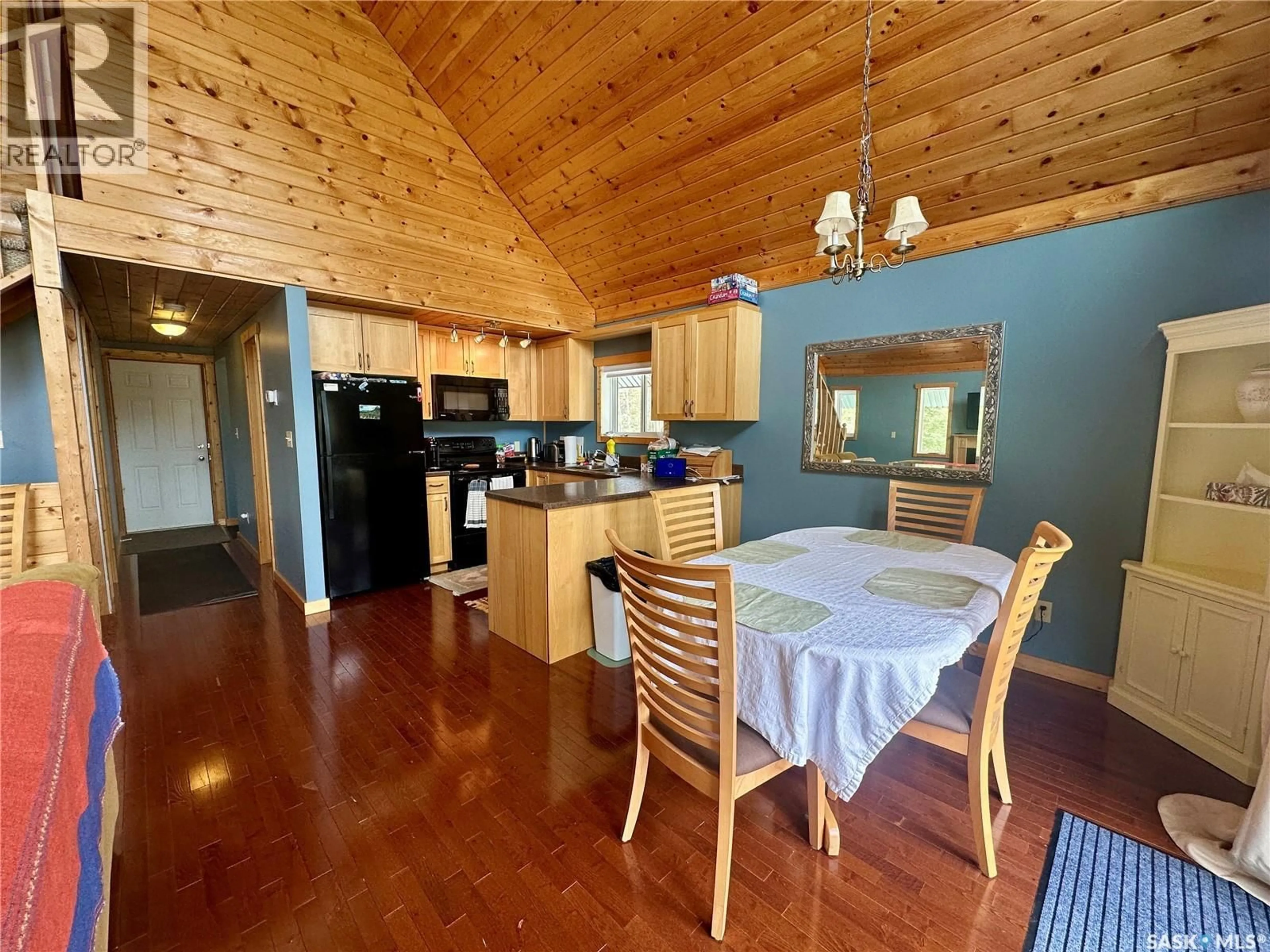 Open concept kitchen, wood/laminate floor for 2404 WAPOOS PLACE, Northern Admin District Saskatchewan S0J1L0