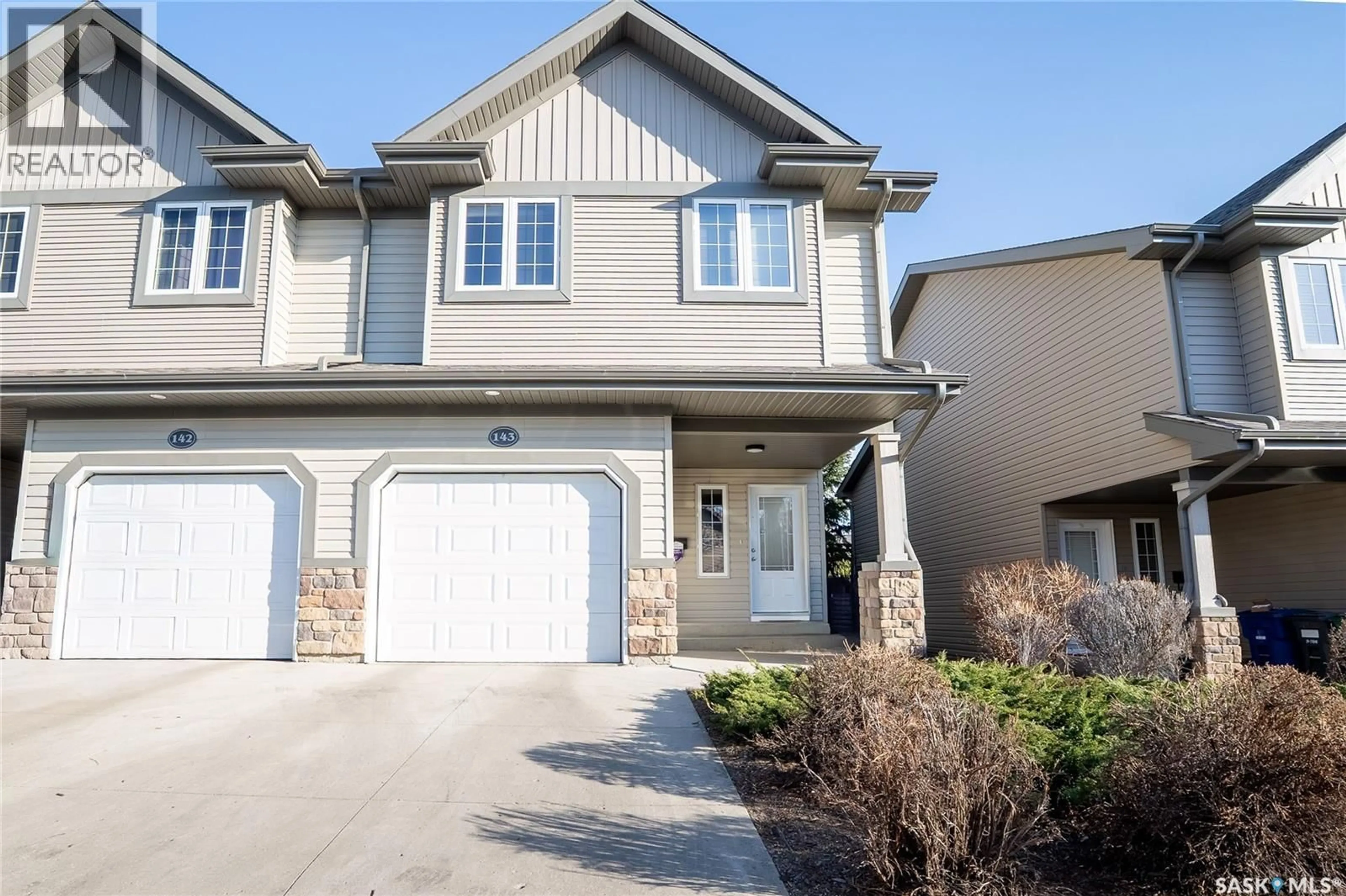 Home with vinyl exterior material, street for 143 615 STENSRUD ROAD, Saskatoon Saskatchewan S7W0A2
