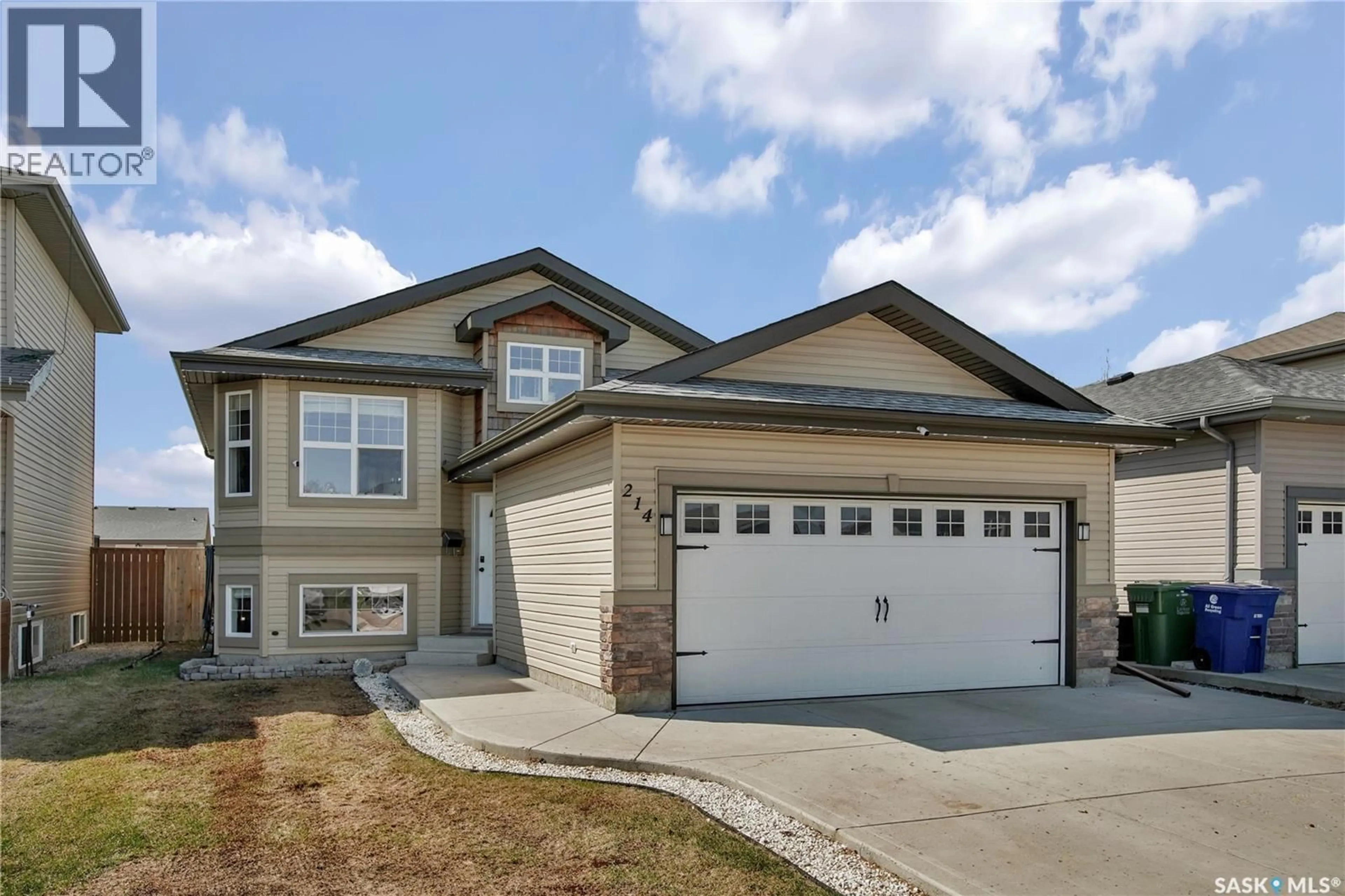 Home with vinyl exterior material, street for 214 QUESSY DRIVE, Martensville Saskatchewan S0K0A2