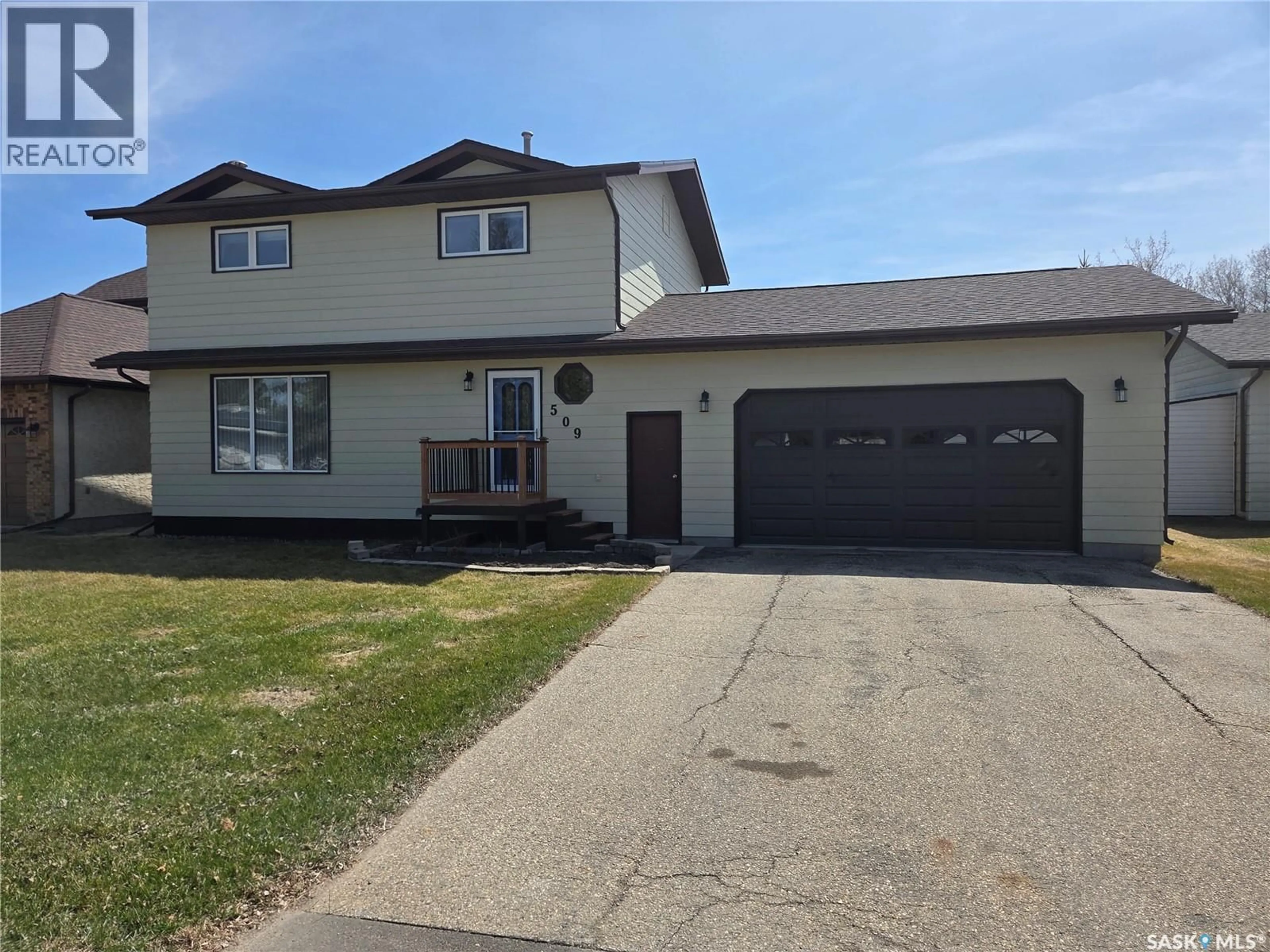 Home with vinyl exterior material, street for 509 CARLYLE AVENUE, Carlyle Saskatchewan S0C0R0