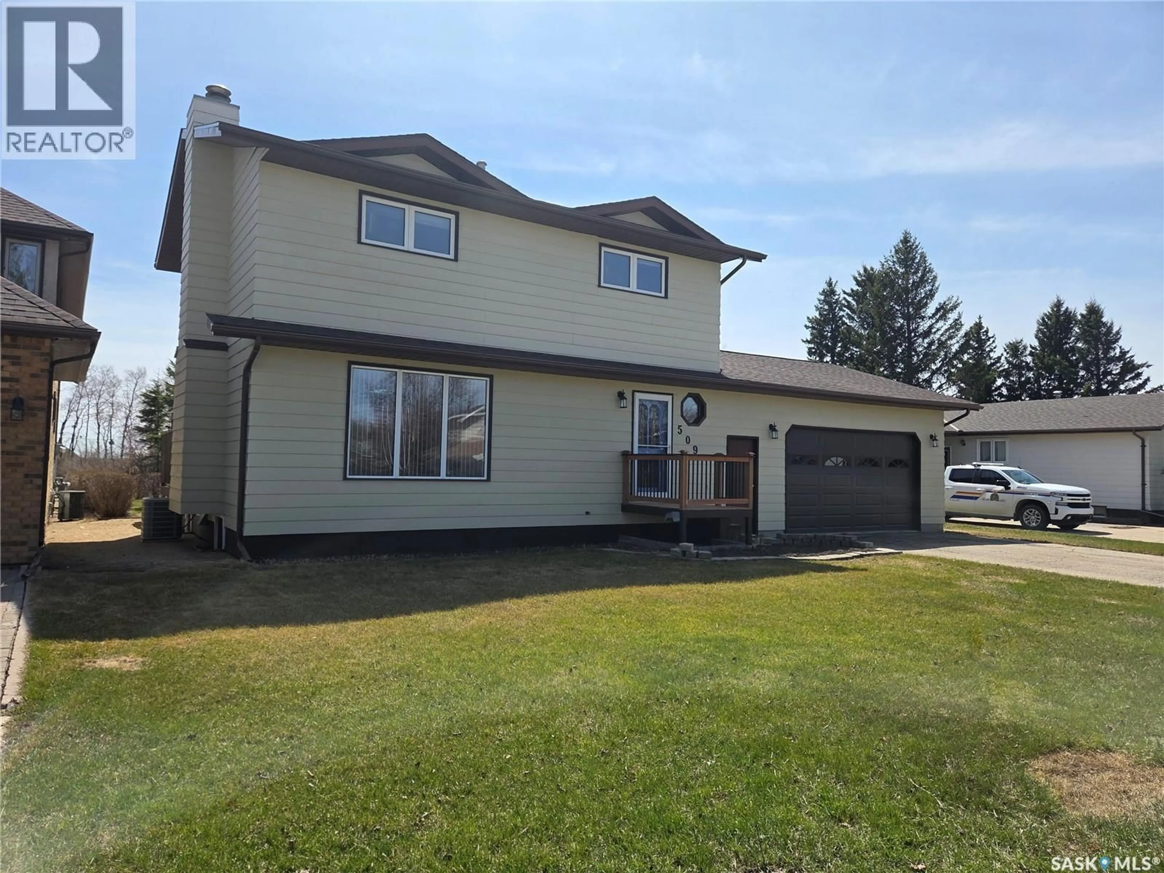 Home with vinyl exterior material, street for 509 CARLYLE AVENUE, Carlyle Saskatchewan S0C0R0
