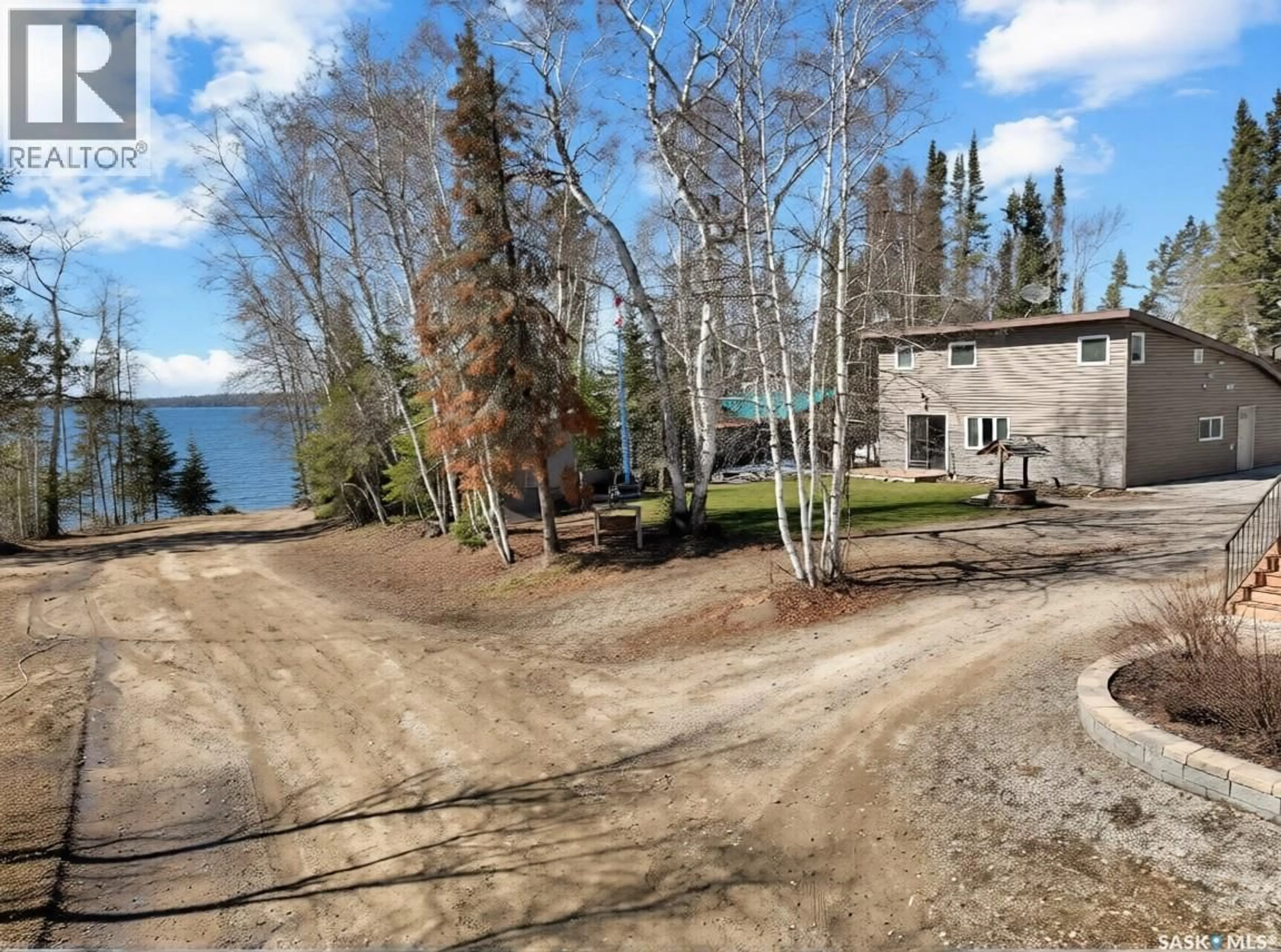A pic from outside/outdoor area/front of a property/back of a property/a pic from drone, water/lake/river/ocean view for 903 BALSAM STREET, White Swan Lake Saskatchewan S0J3E0