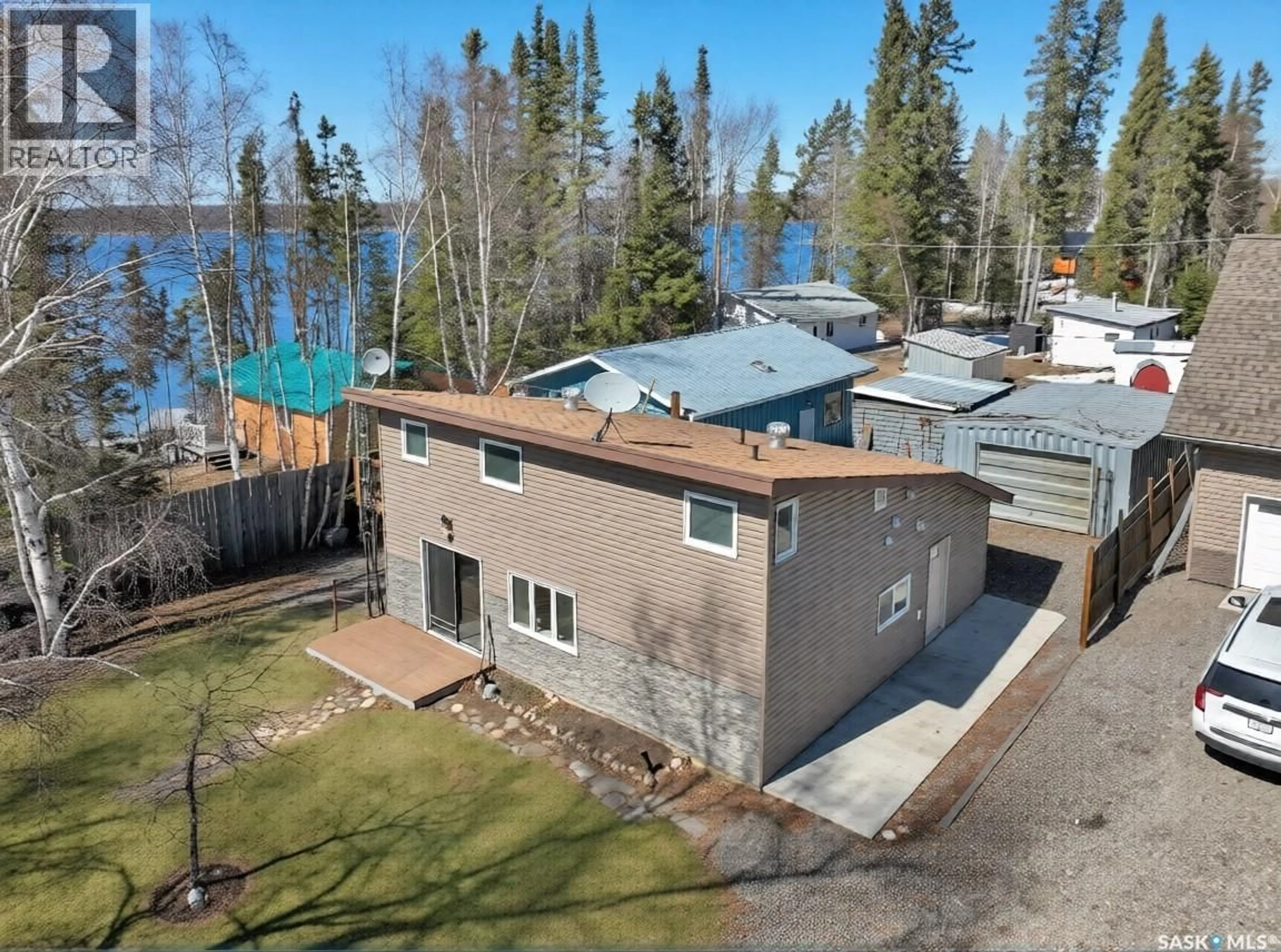 A pic from outside/outdoor area/front of a property/back of a property/a pic from drone, water/lake/river/ocean view for 903 BALSAM STREET, White Swan Lake Saskatchewan S0J3E0