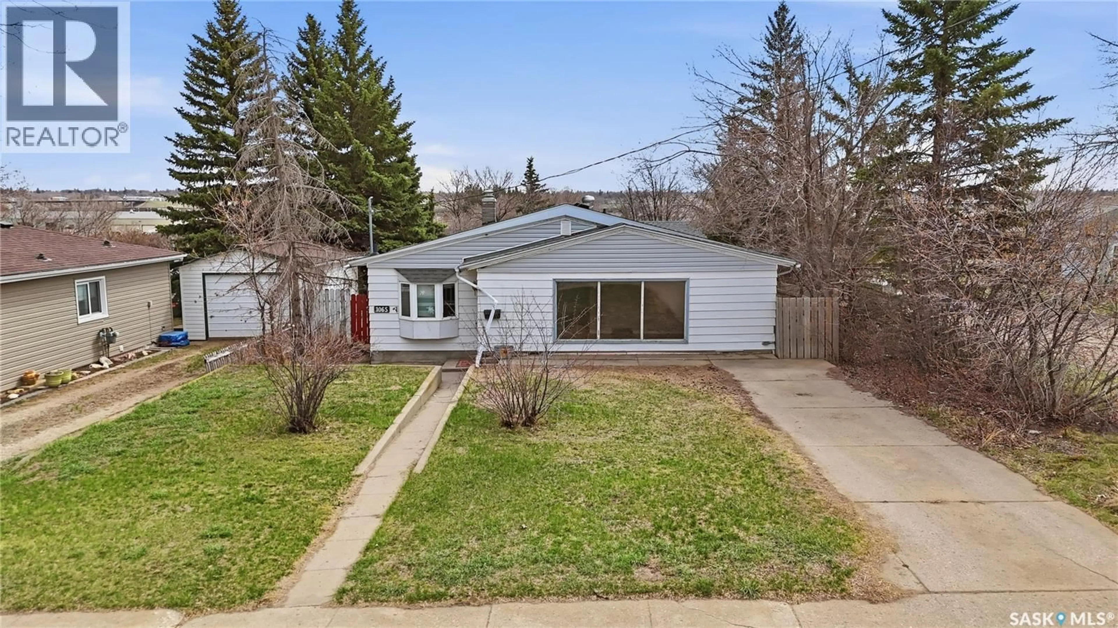 A pic from outside/outdoor area/front of a property/back of a property/a pic from drone, street for W - 1065 STADACONA STREET, Moose Jaw Saskatchewan S6H2B1