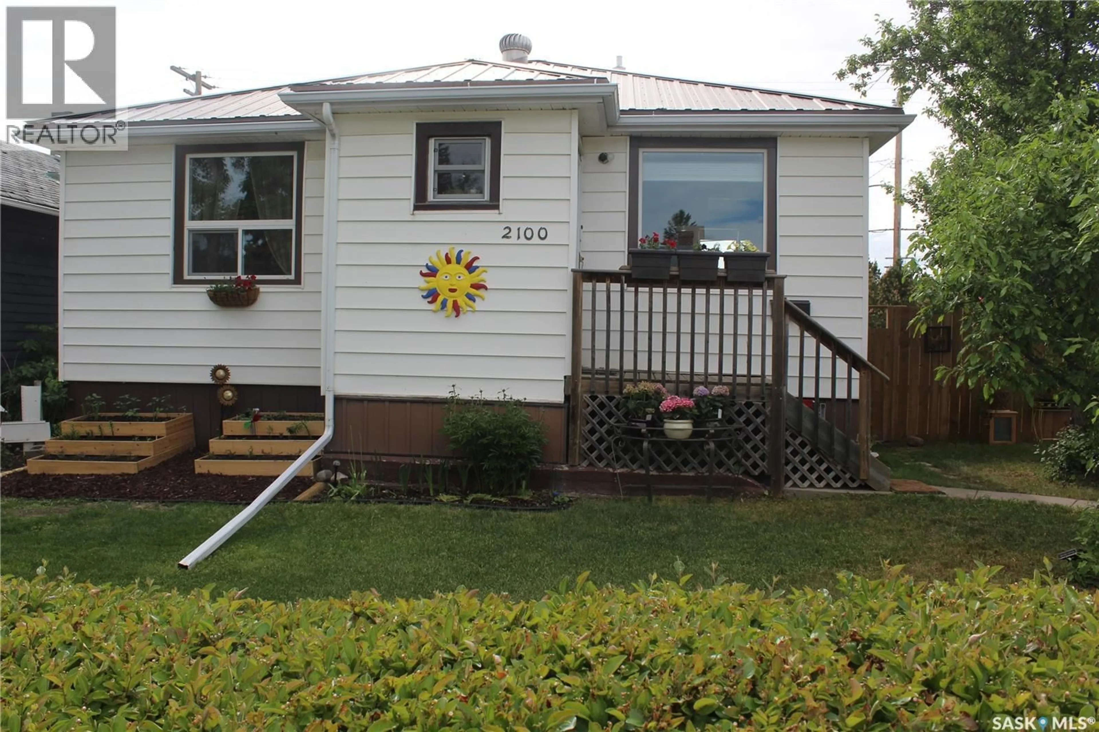 Home with vinyl exterior material, street for 2100 WASCANA STREET, Regina Saskatchewan S4T4J9
