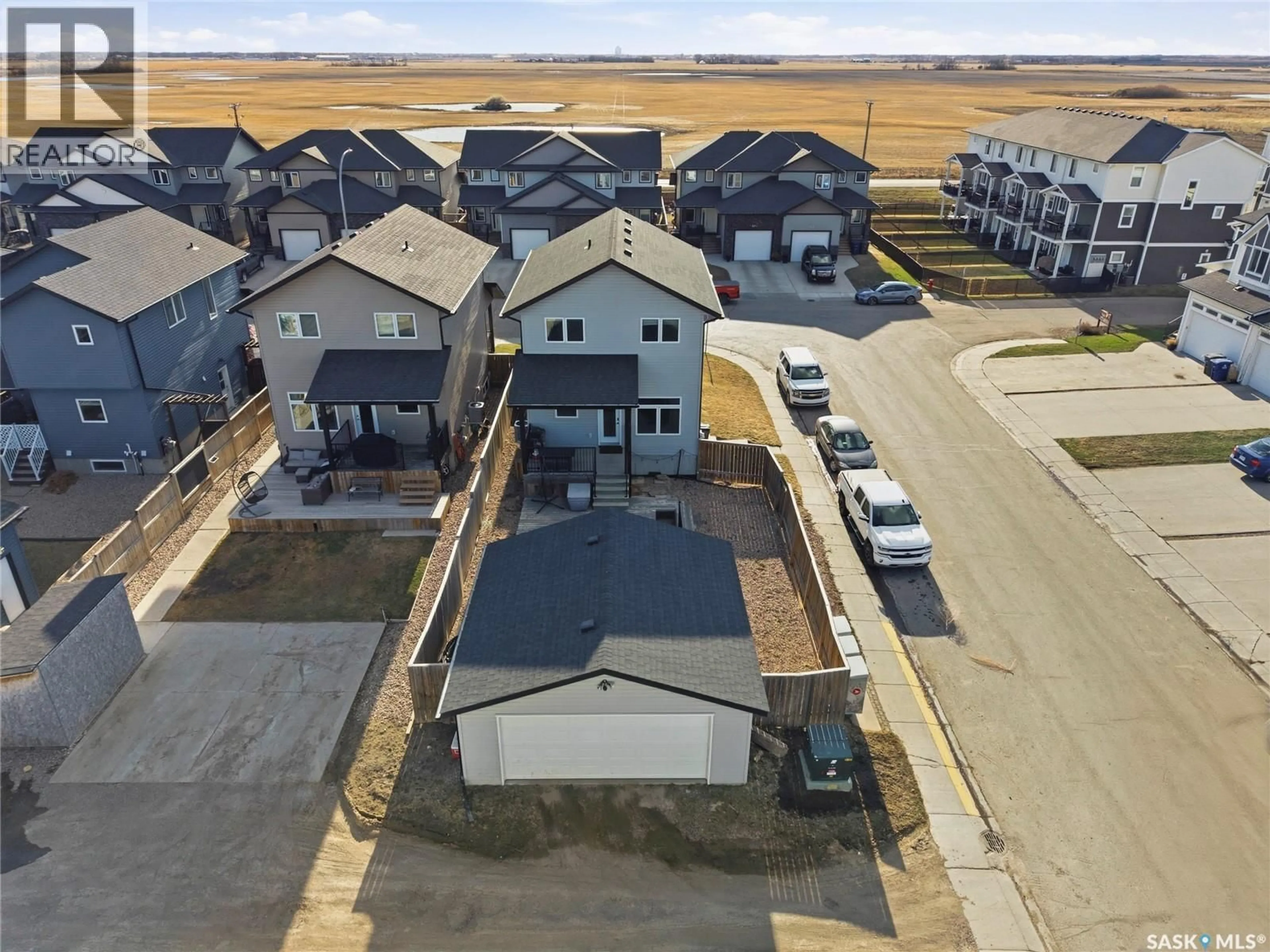A pic from outside/outdoor area/front of a property/back of a property/a pic from drone, street for 534 MAPLE CRESCENT, Warman Saskatchewan S0K4S2
