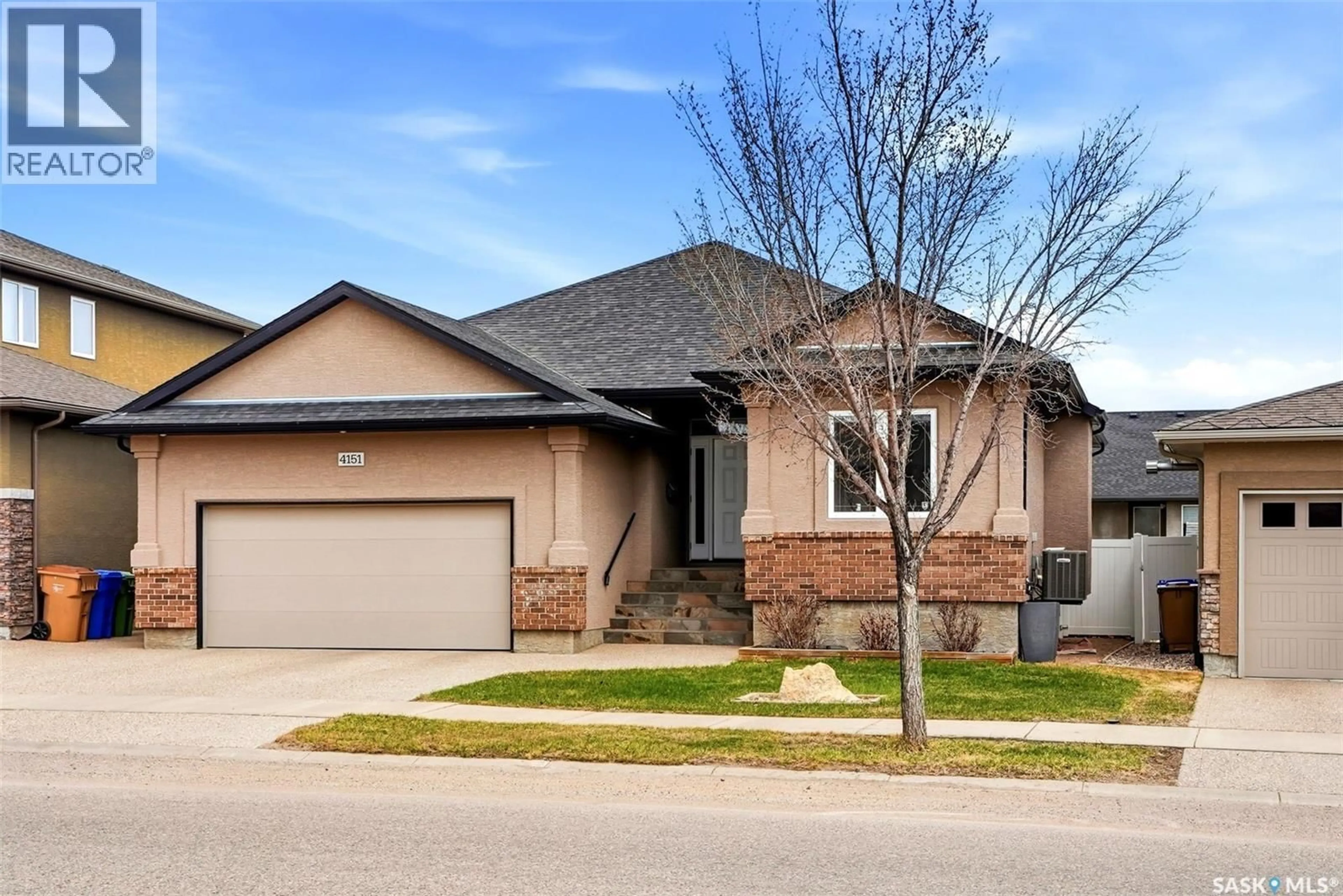 Home with brick exterior material, street for 4151 CHUKA DRIVE, Regina Saskatchewan S4V1N2