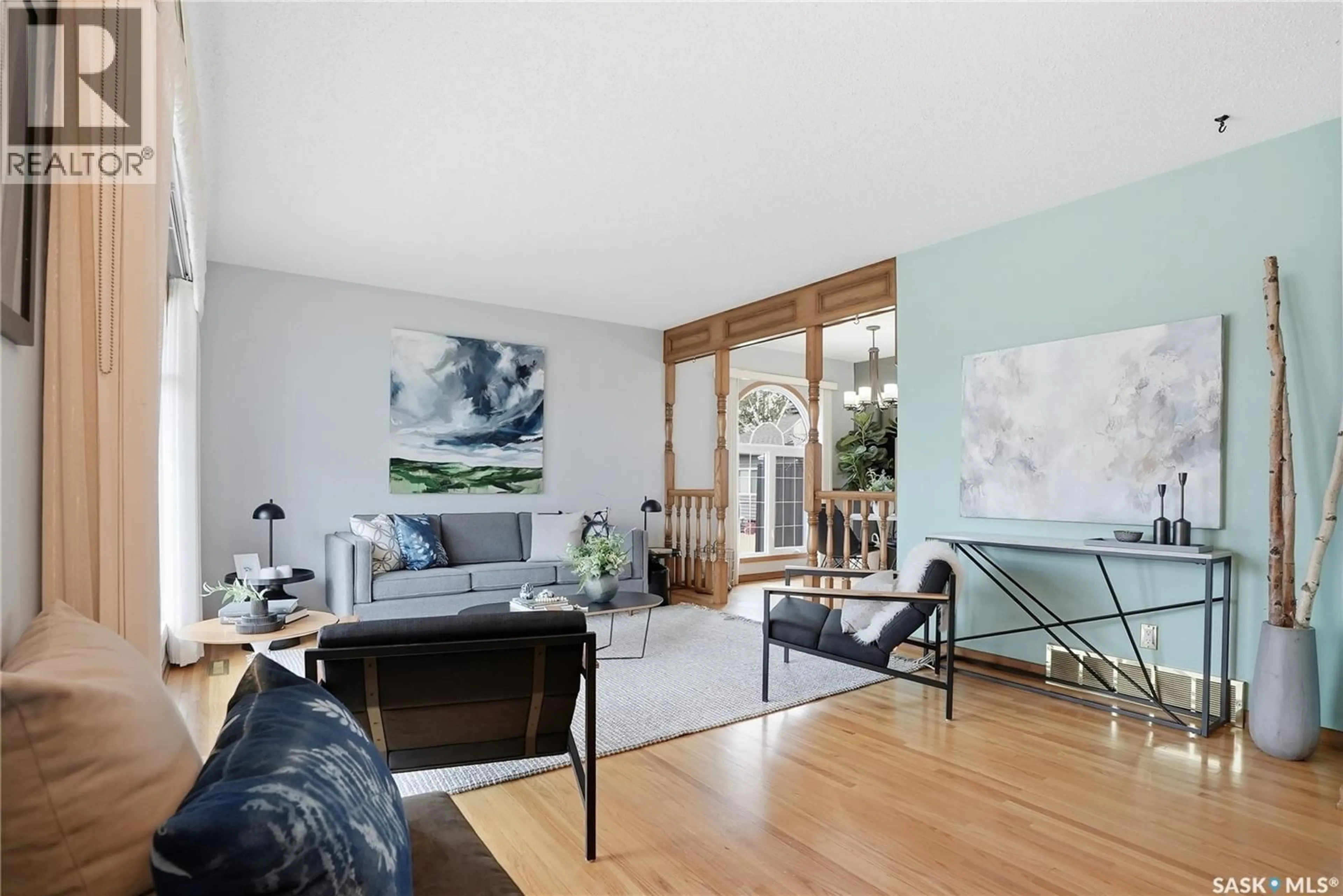 Living room with furniture, wood/laminate floor for 36 MORRIS DRIVE, Saskatoon Saskatchewan S7L3T9