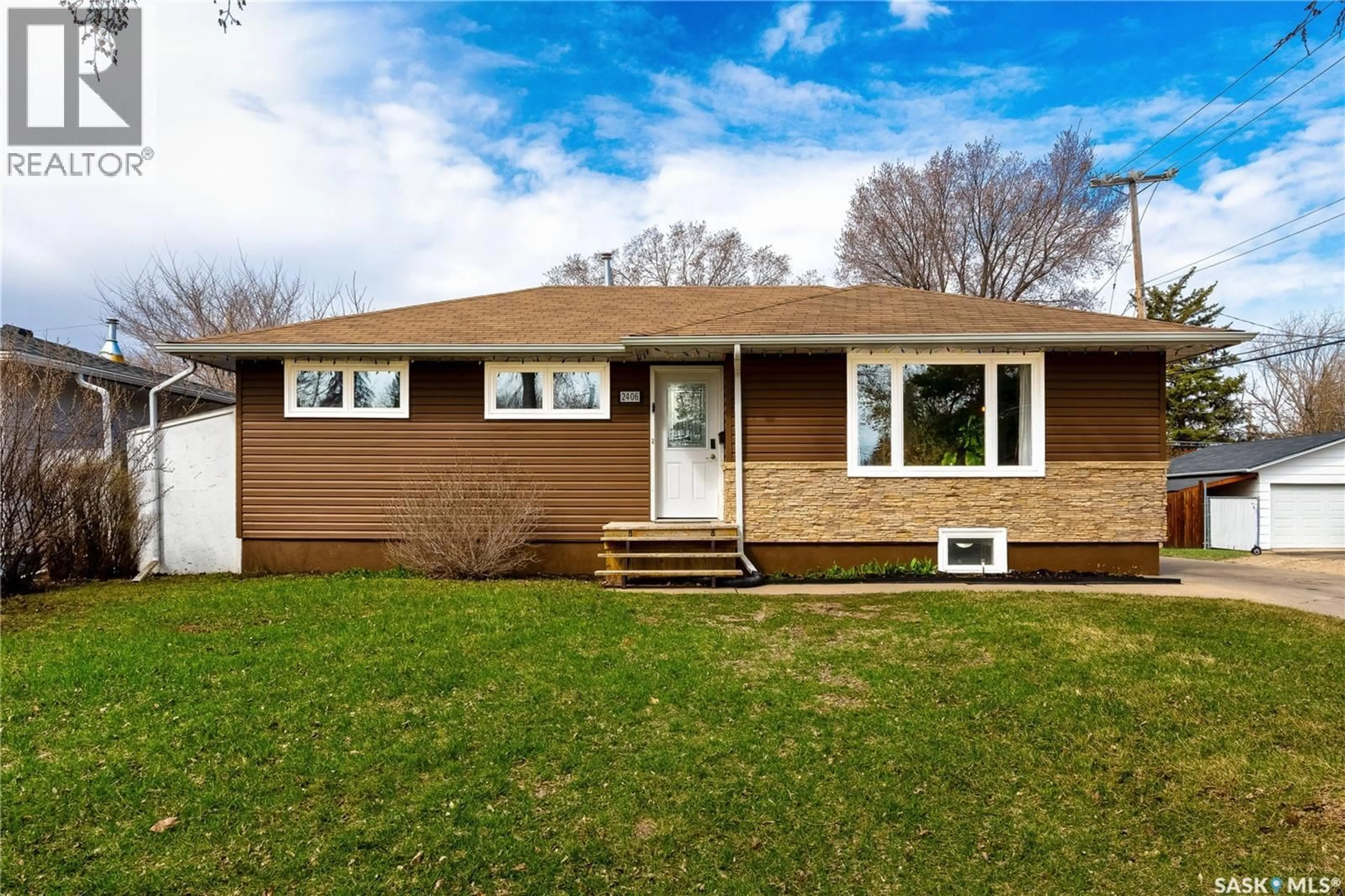 Home with vinyl exterior material, street for 2406 IRVINE AVENUE, Saskatoon Saskatchewan S7J2A8