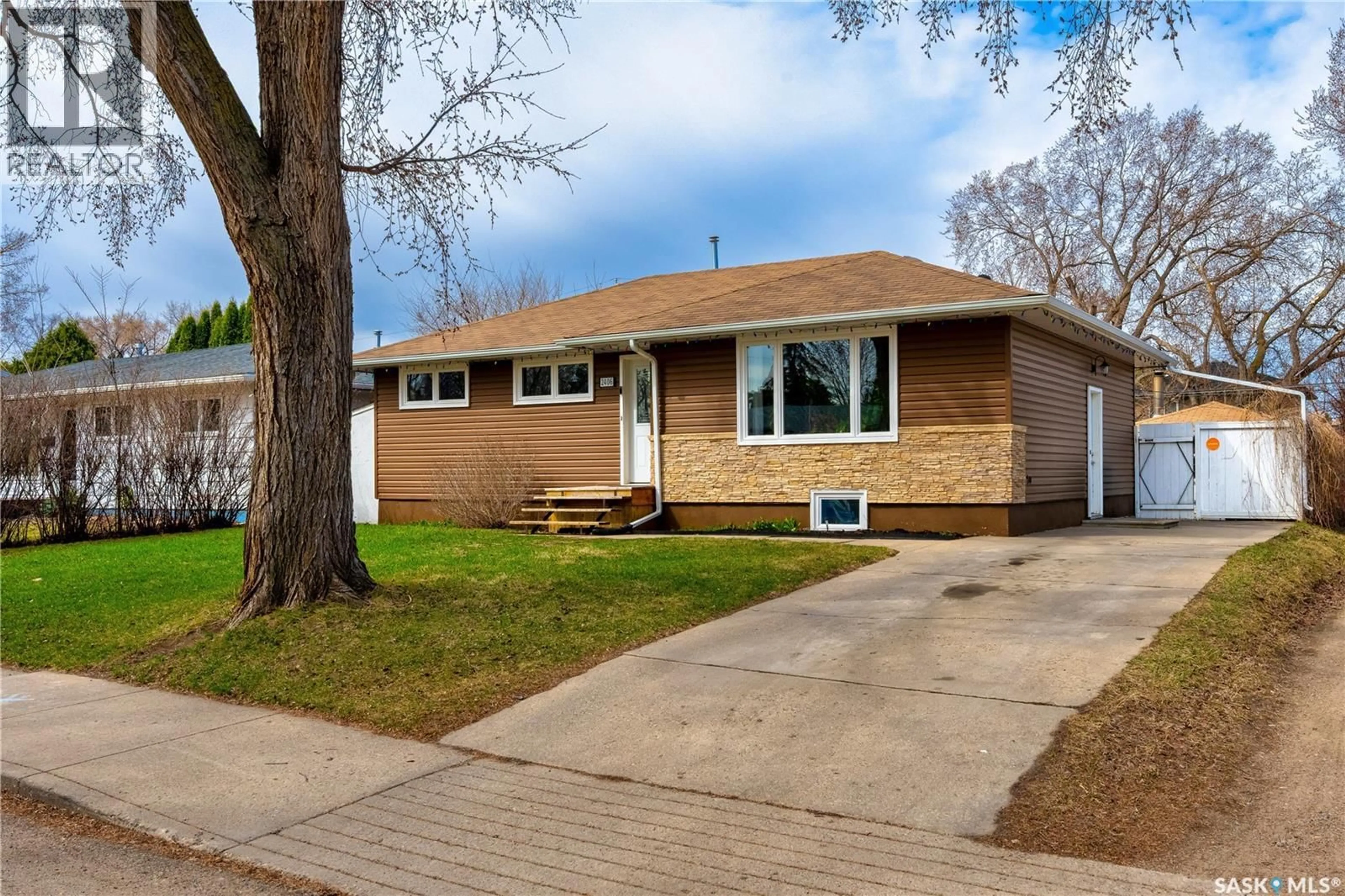 Home with vinyl exterior material, street for 2406 IRVINE AVENUE, Saskatoon Saskatchewan S7J2A8