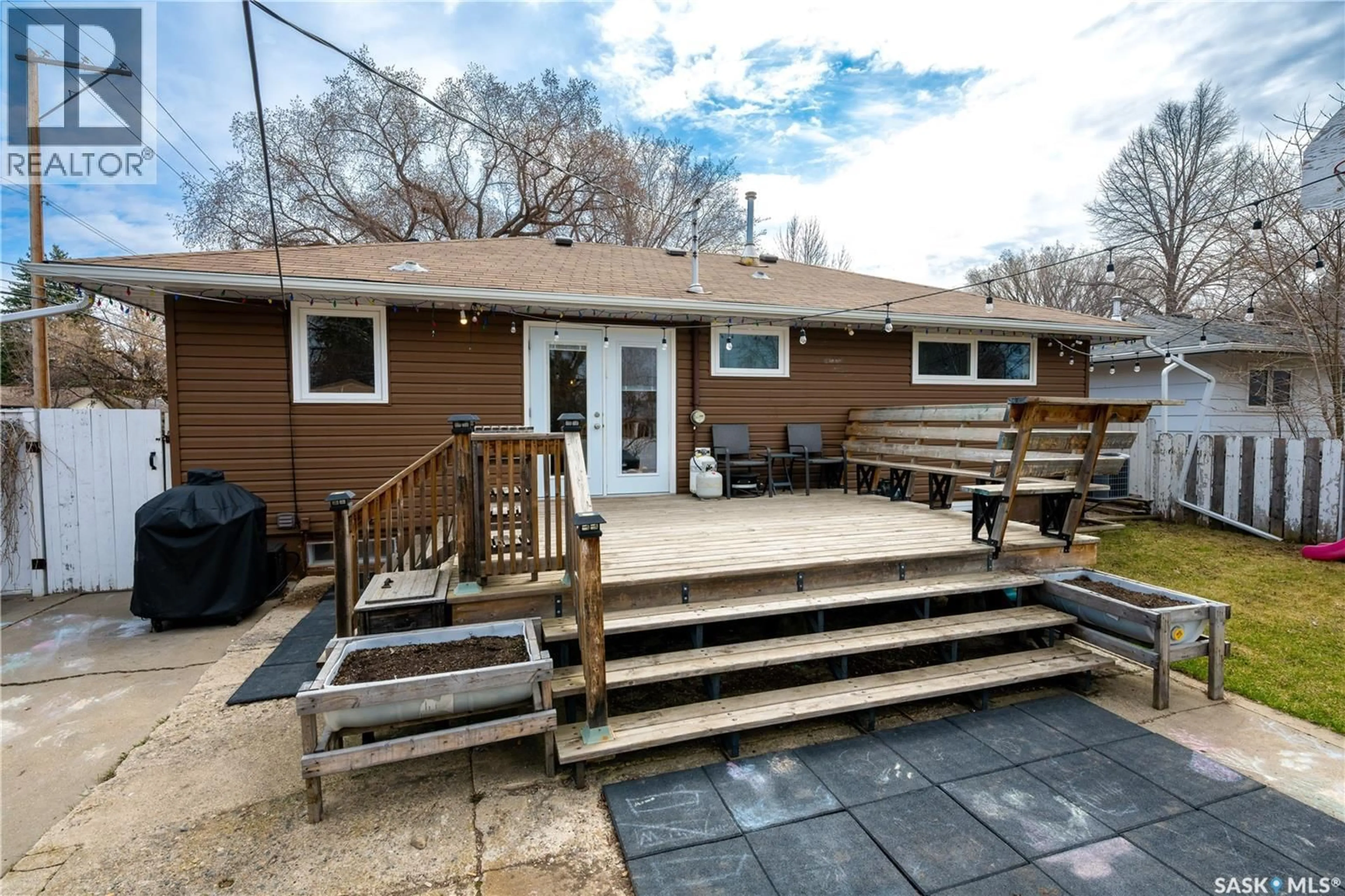 Home with vinyl exterior material, street for 2406 IRVINE AVENUE, Saskatoon Saskatchewan S7J2A8