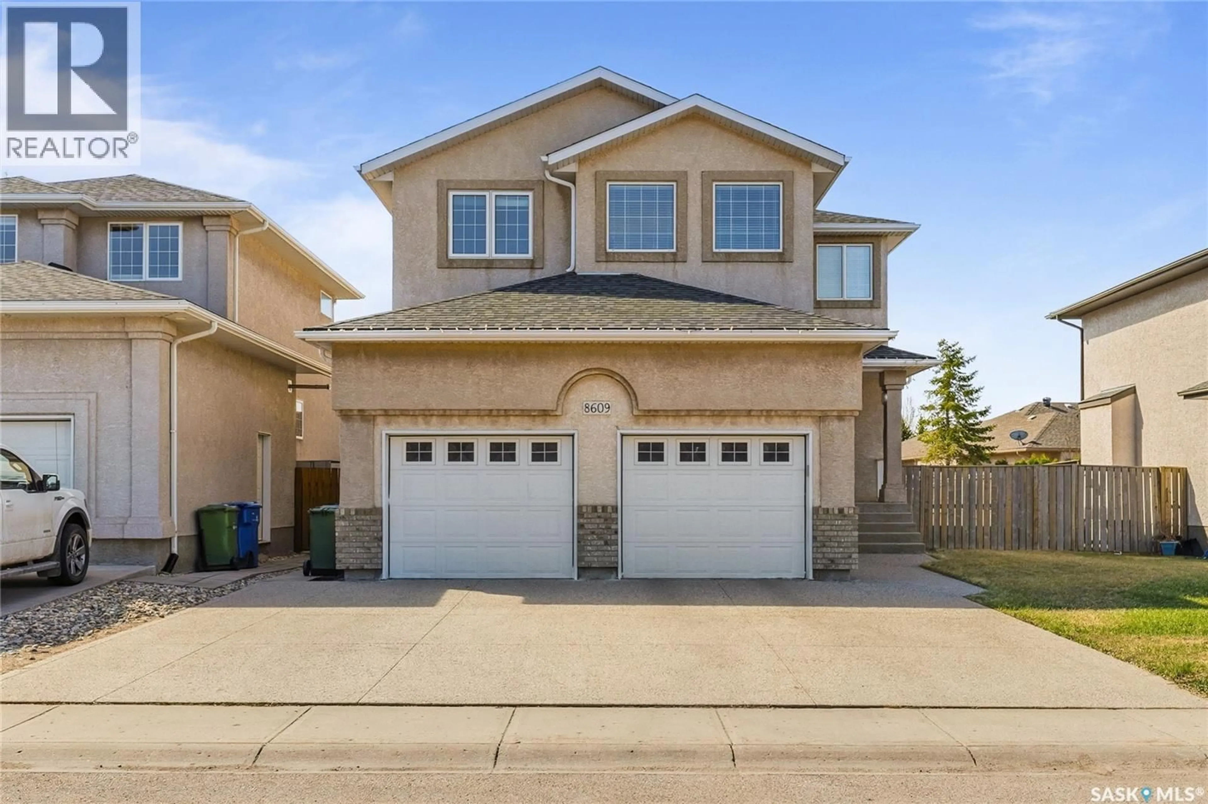 Home with vinyl exterior material, street for 8609 SHERWOOD DRIVE, Regina Saskatchewan S4Y1A5