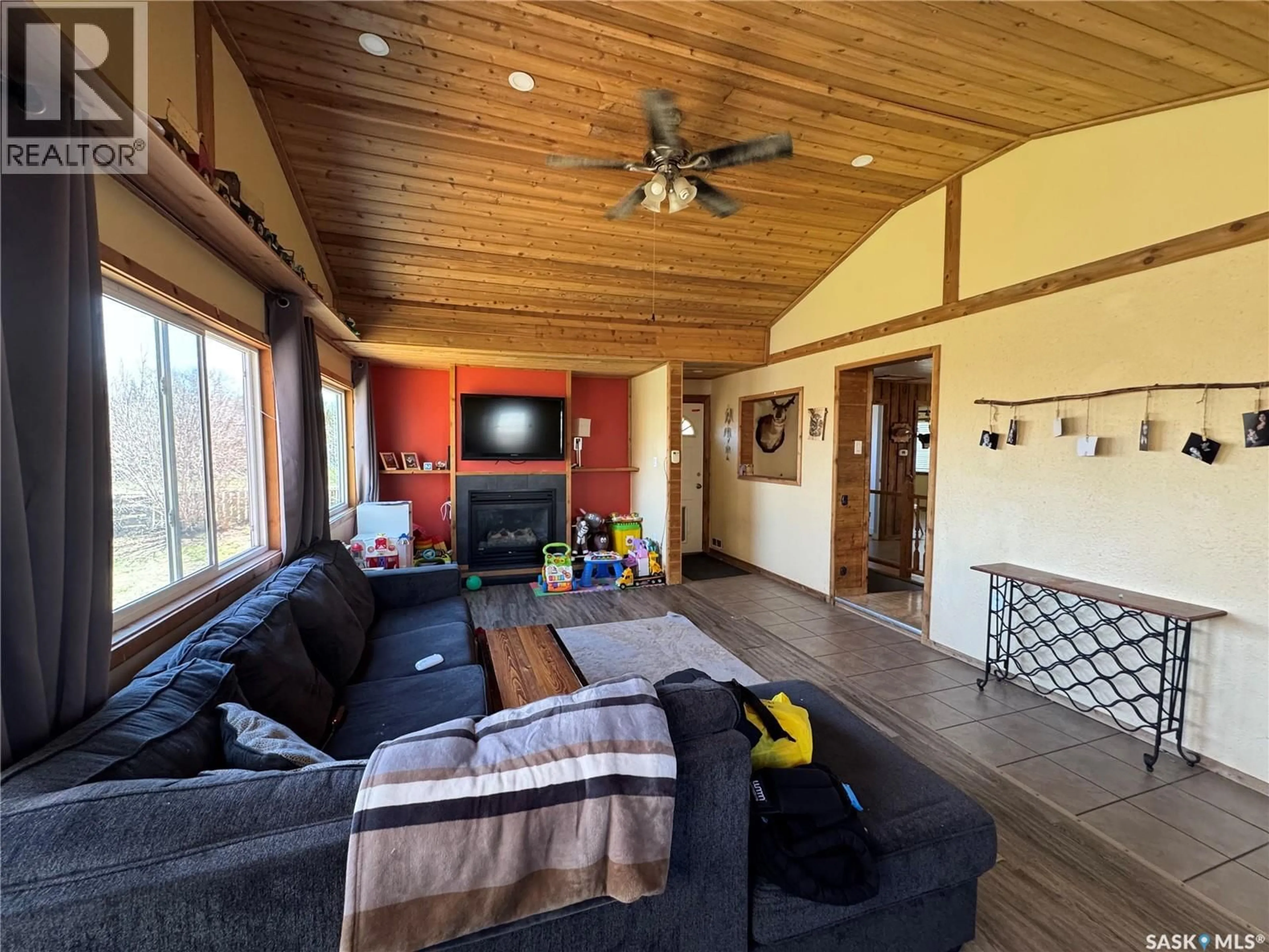 Living room with furniture, wood/laminate floor for 381 2ND STREET, Disley Saskatchewan S0G0H0