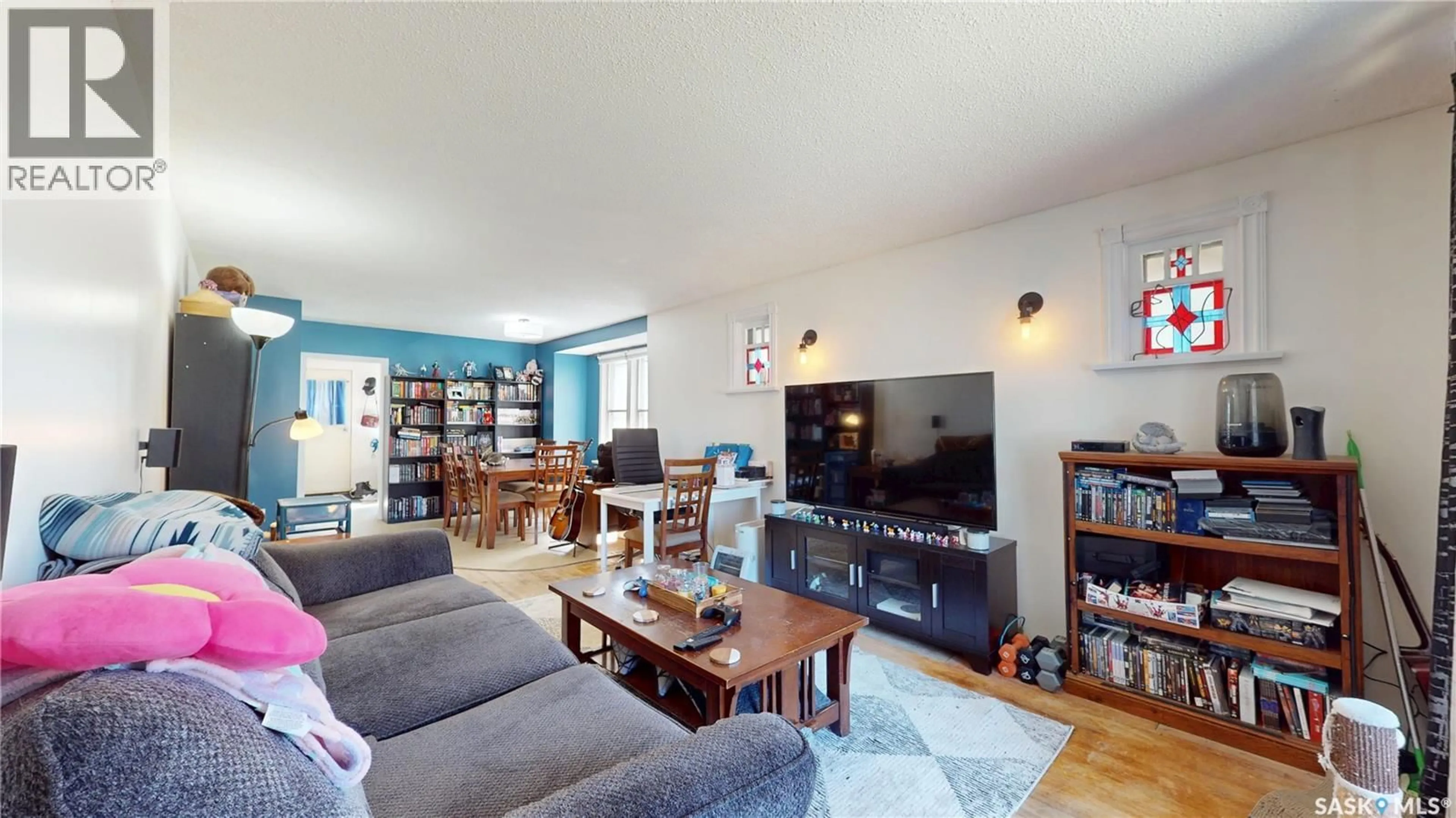 Living room with furniture, wood/laminate floor for 1337 MCTAVISH STREET, Regina Saskatchewan S4T3W1