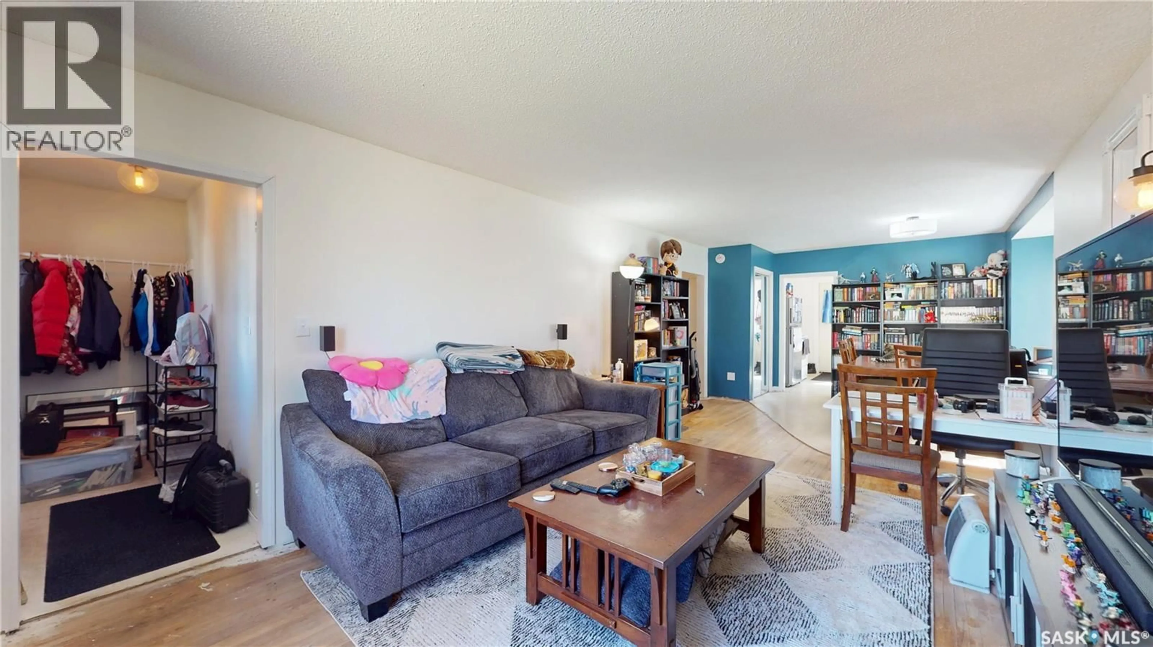 Living room with furniture, wood/laminate floor for 1337 MCTAVISH STREET, Regina Saskatchewan S4T3W1