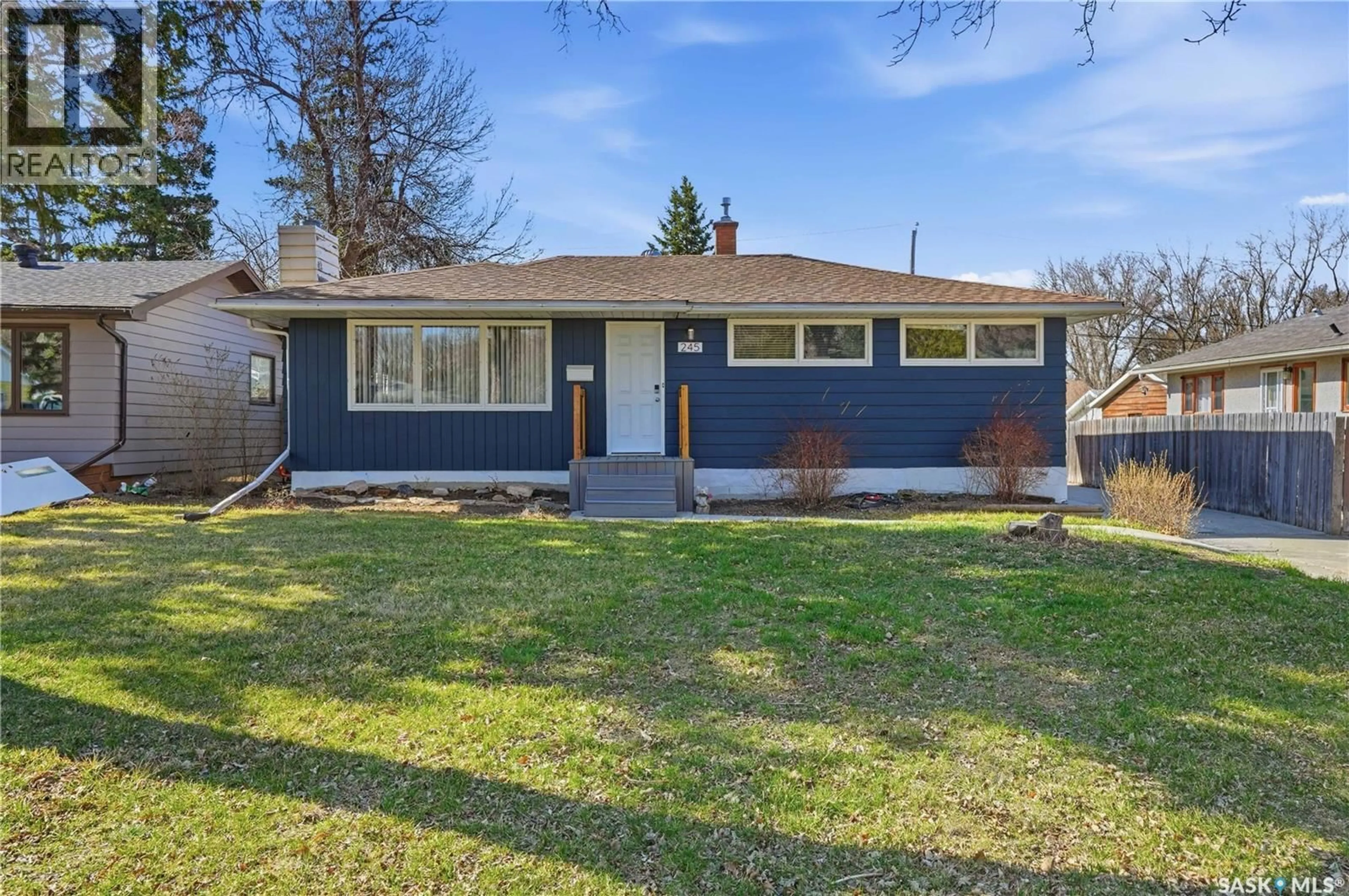 Home with vinyl exterior material, street for 245 ORCHARD CRESCENT, Regina Saskatchewan S4S5B9