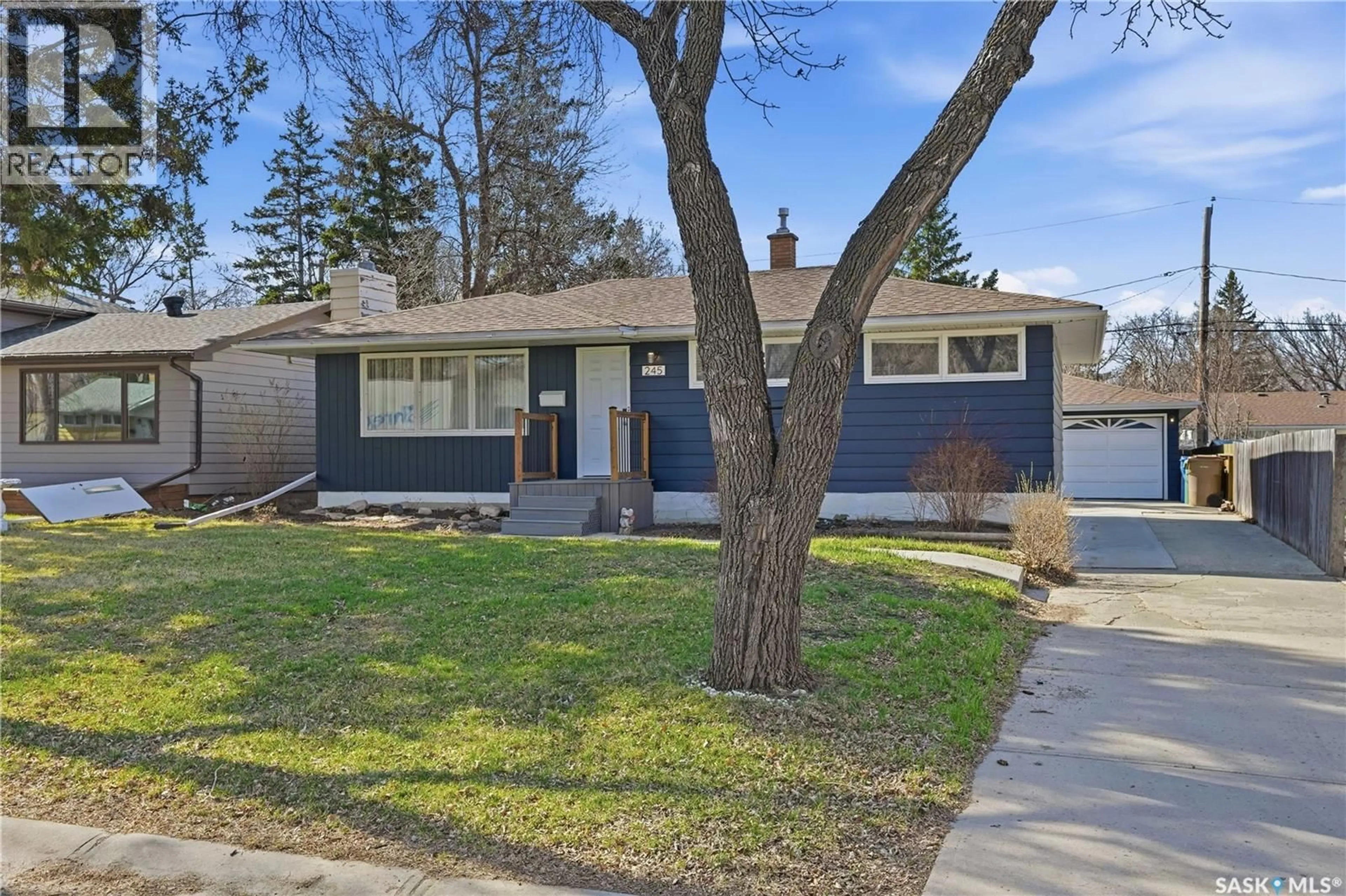 Home with vinyl exterior material, street for 245 ORCHARD CRESCENT, Regina Saskatchewan S4S5B9
