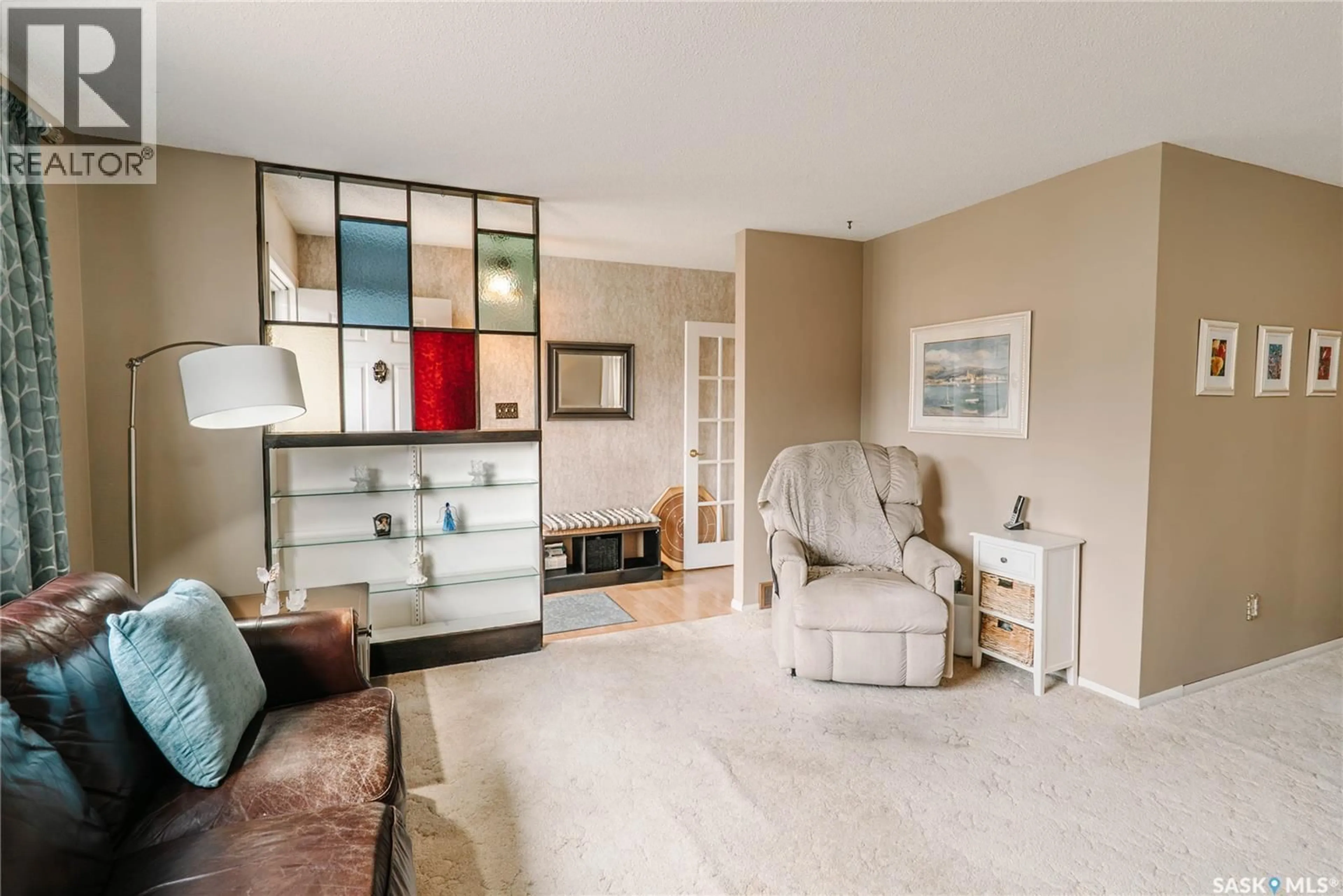 Living room with furniture, ceramic/tile floor for 134 MACLEAN CRESCENT, Saskatoon Saskatchewan S7J2R7