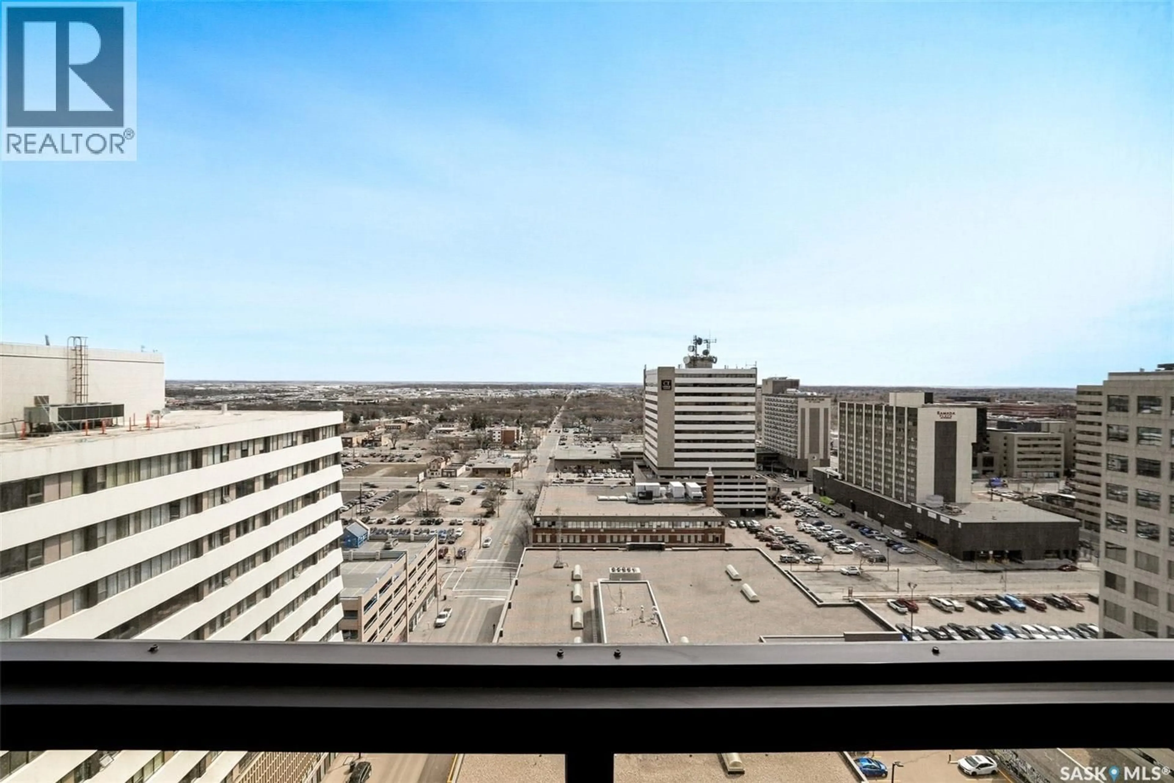 Balcony in the apartment, city buildings view from balcony for PH 201 - 1914 HAMILTON STREET, Regina Saskatchewan S4P3N6