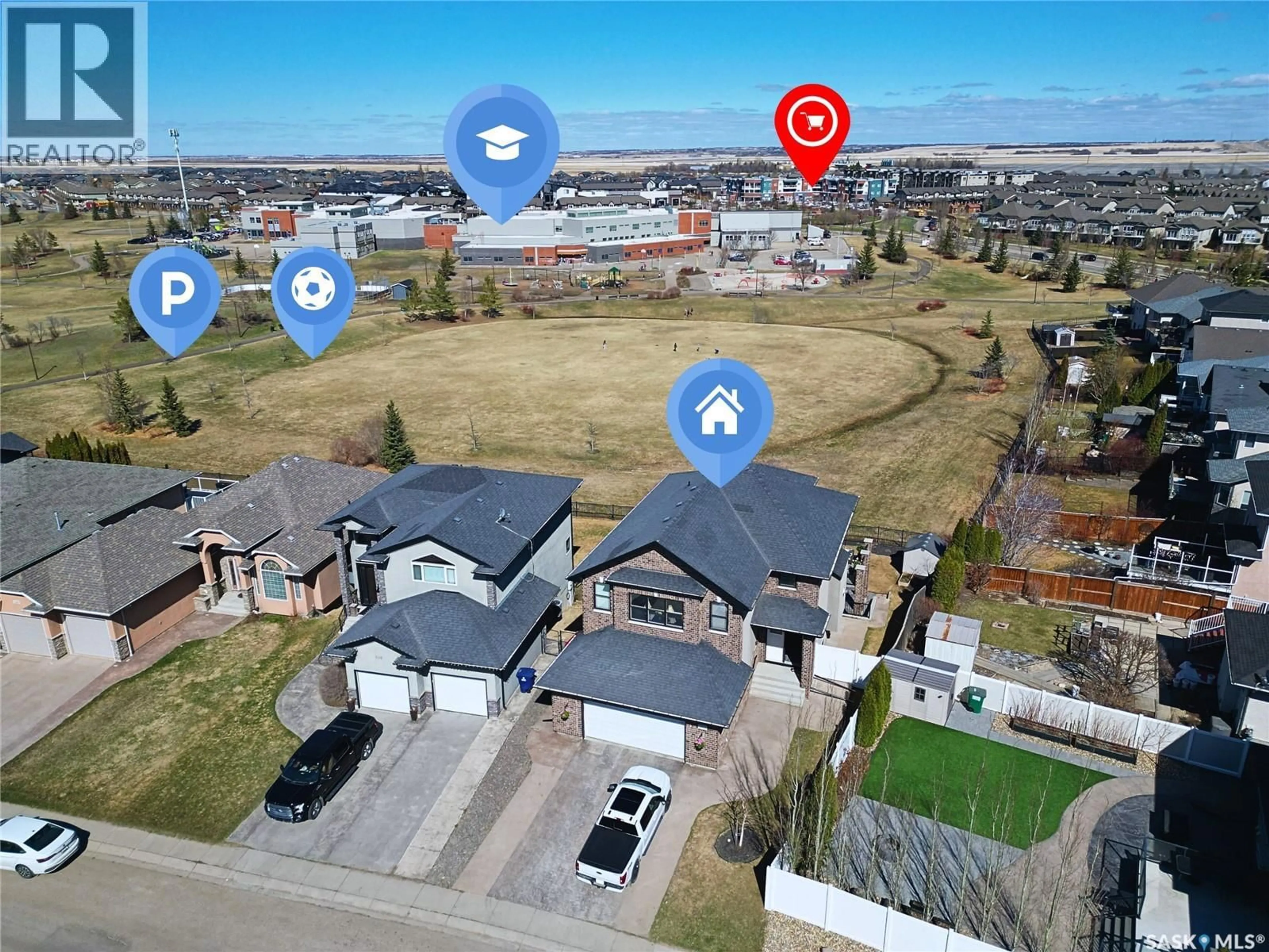 A pic from outside/outdoor area/front of a property/back of a property/a pic from drone, street for 102 THODE AVENUE, Saskatoon Saskatchewan S7W1A1