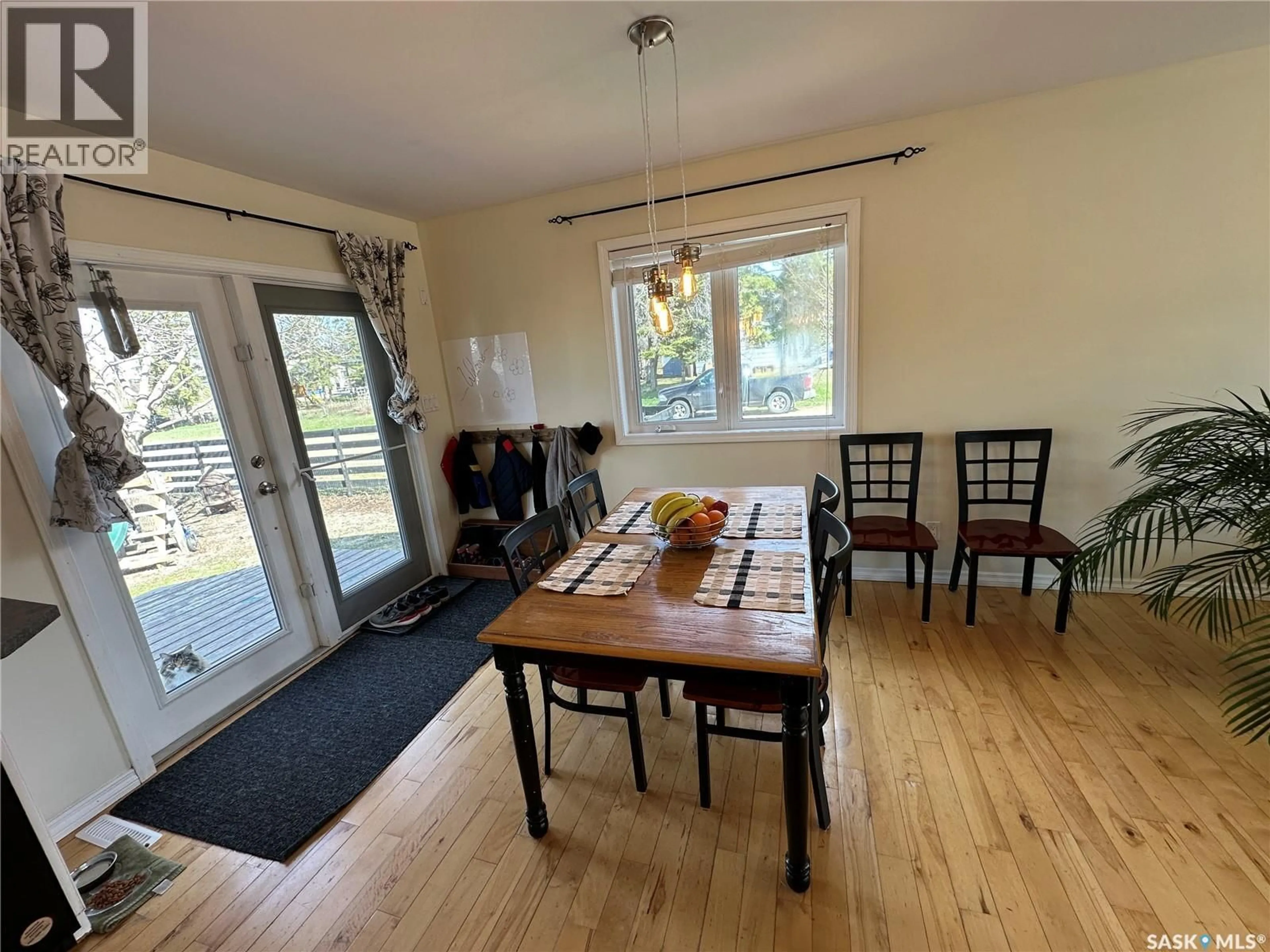 Dining room, wood/laminate floor for 1020 4TH AVENUE, Rosthern Saskatchewan S0K3R0
