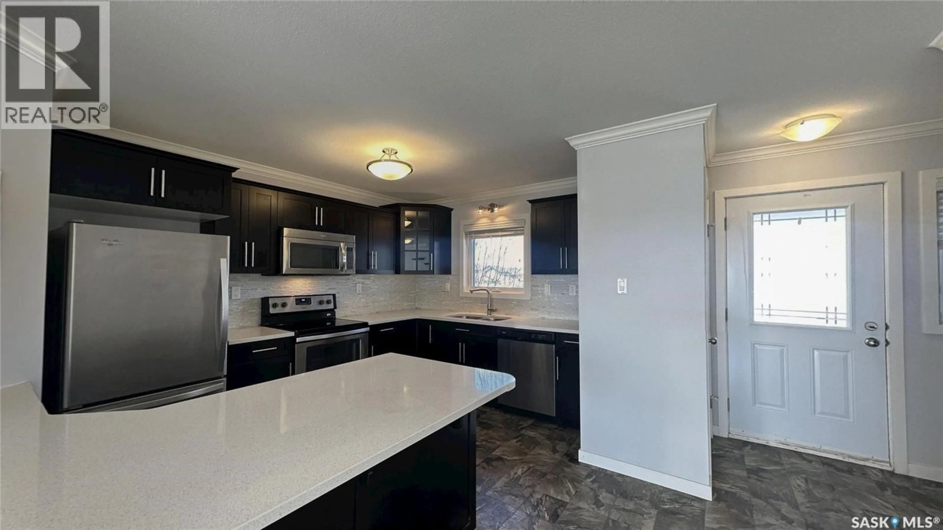 Open concept kitchen, ceramic/tile floor for 250 - 271 AKHTAR BEND, Saskatoon Saskatchewan S7W0W4