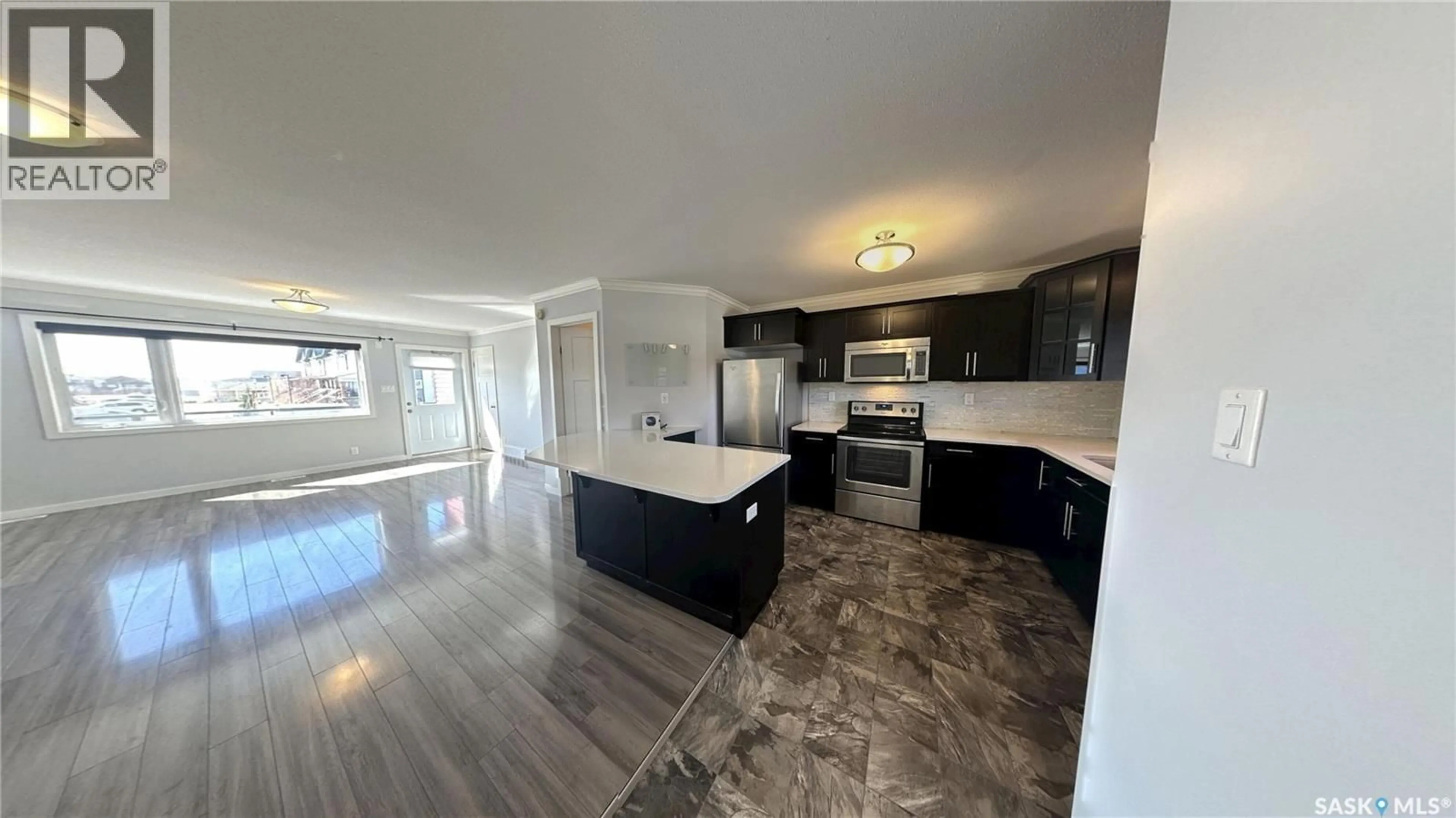 Open concept kitchen, ceramic/tile floor for 250 - 271 AKHTAR BEND, Saskatoon Saskatchewan S7W0W4