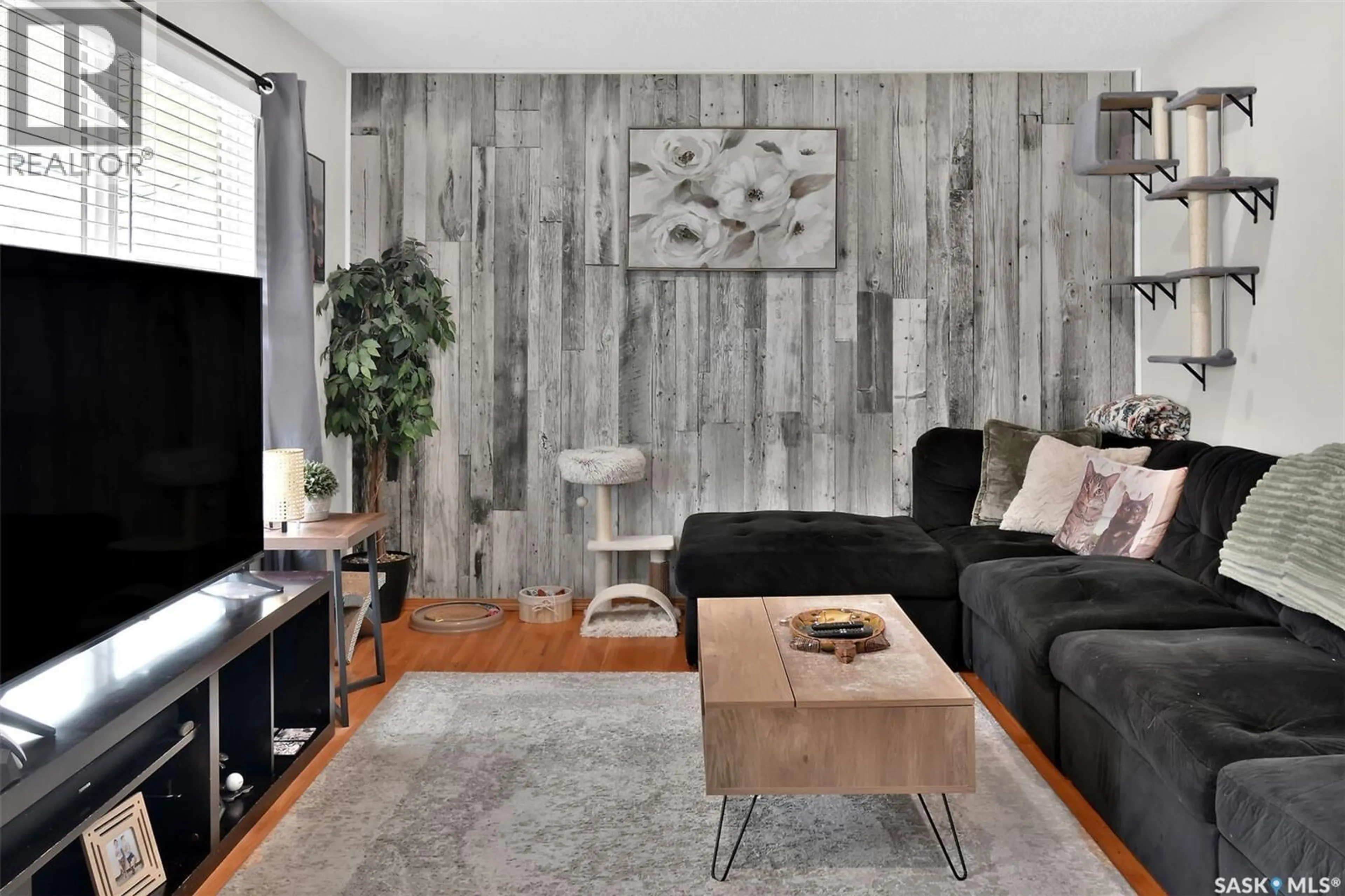 Living room with furniture, wood/laminate floor for 1622 BRADWELL AVENUE, Saskatoon Saskatchewan S7N2P1