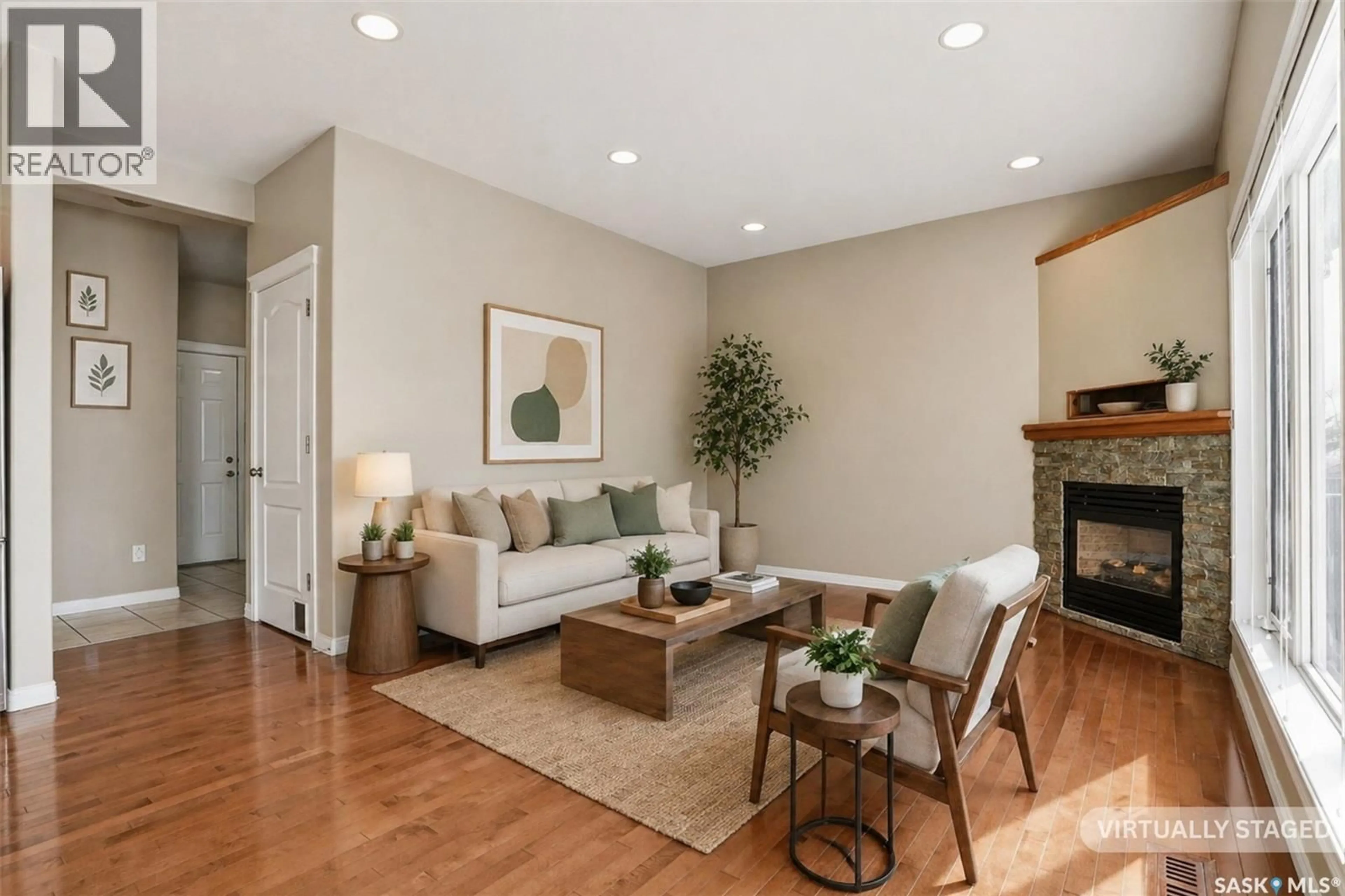 Living room with furniture, wood/laminate floor for 607 BECKETT CRESCENT, Saskatoon Saskatchewan S7N4X3