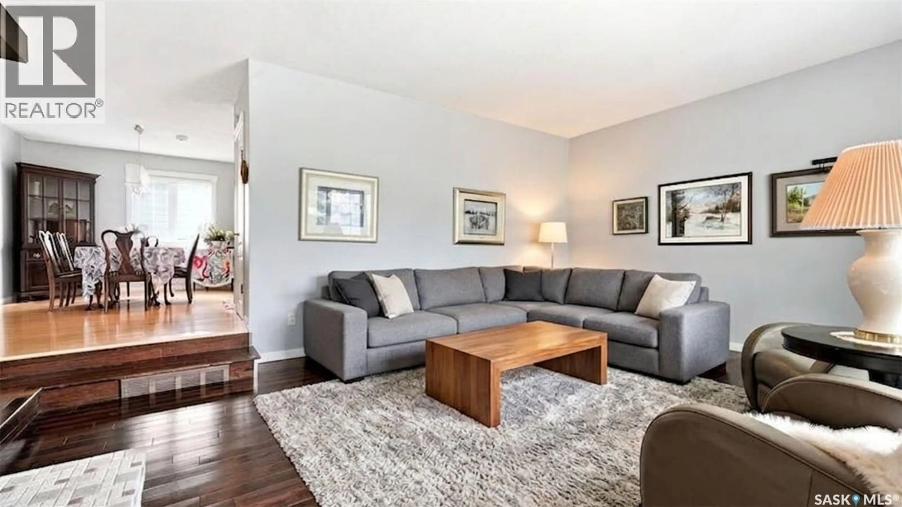 Living room with furniture, wood/laminate floor for 4220 HILLSDALE STREET, Regina Saskatchewan S4S3Z2
