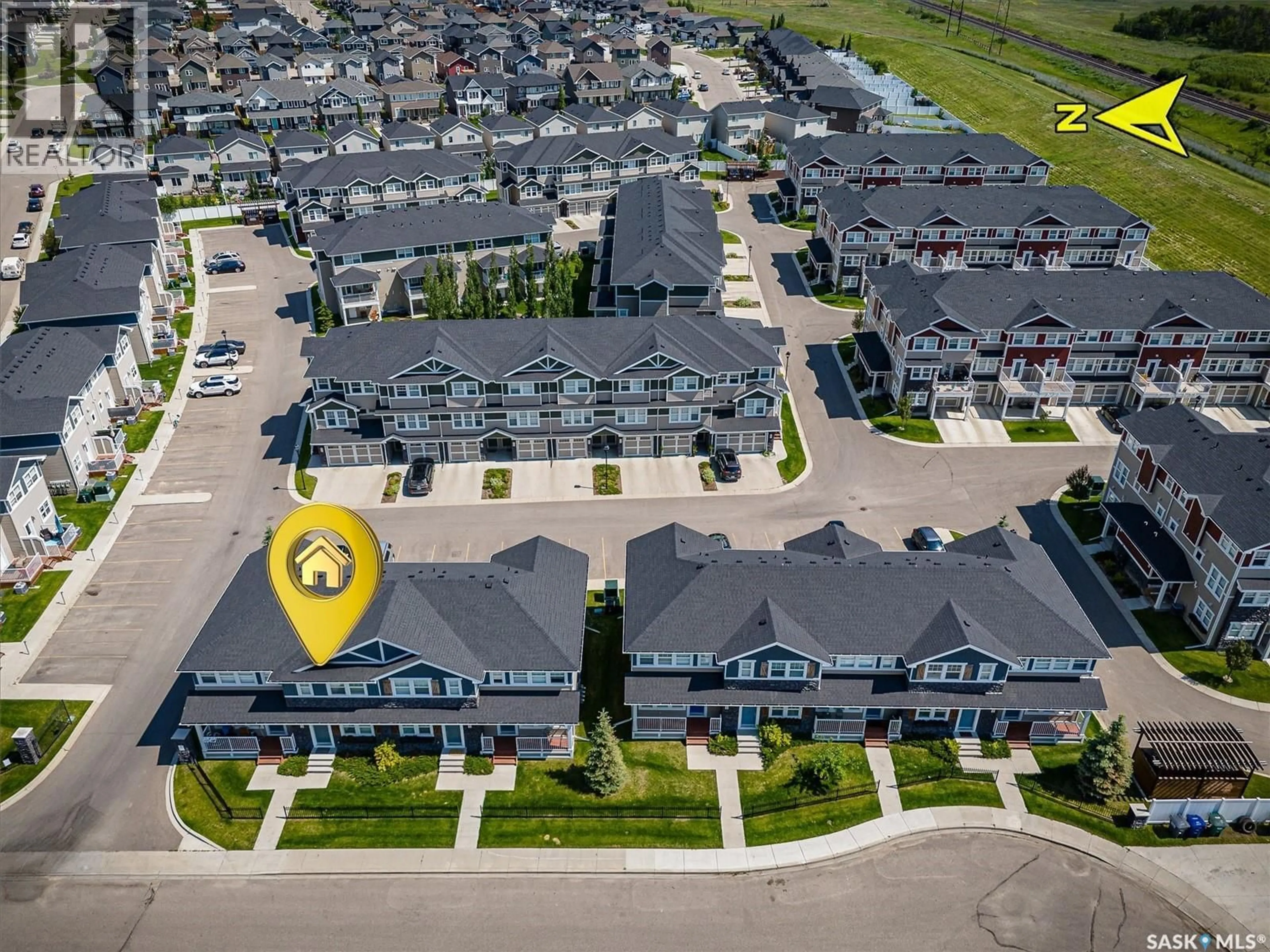 A pic from outside/outdoor area/front of a property/back of a property/a pic from drone, street for 1216 PRINGLE WAY, Saskatoon Saskatchewan S7T0X5