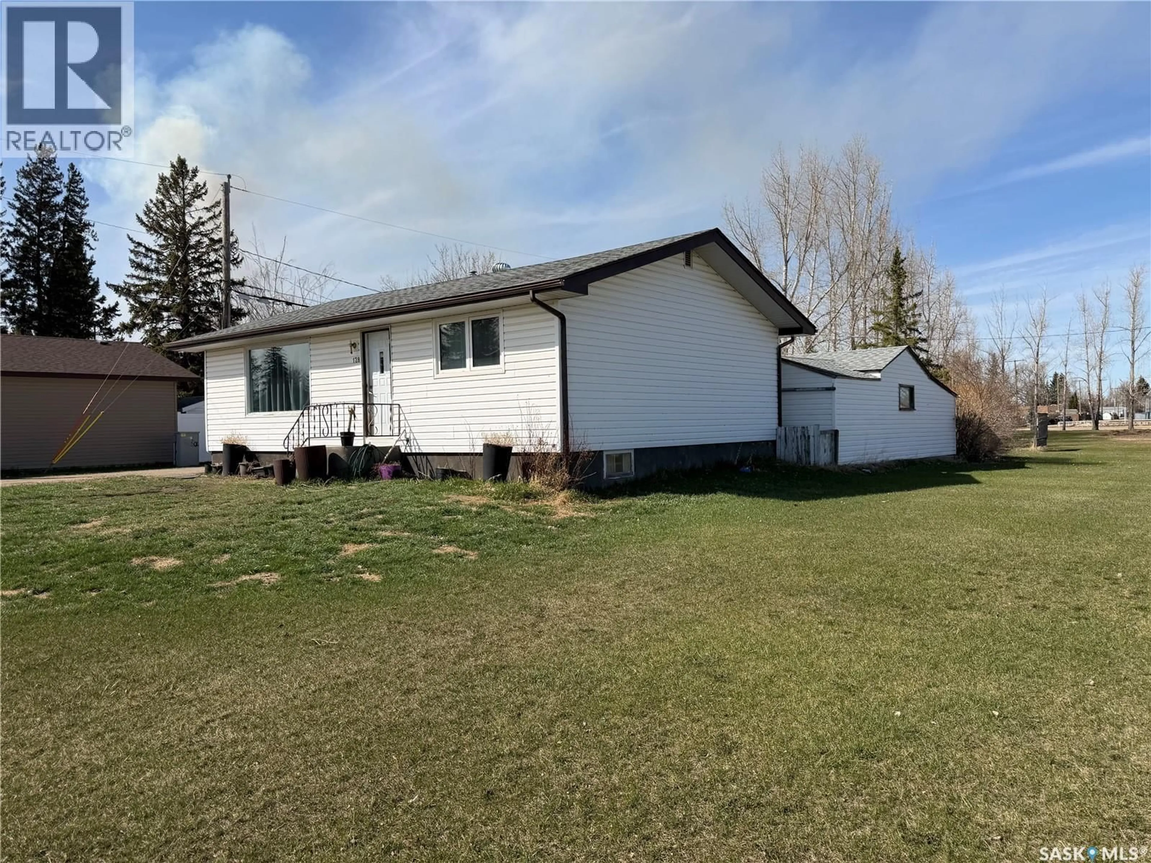 A pic from outside/outdoor area/front of a property/back of a property/a pic from drone, street for 128 9TH AVENUE, Melville Saskatchewan S0A2P0
