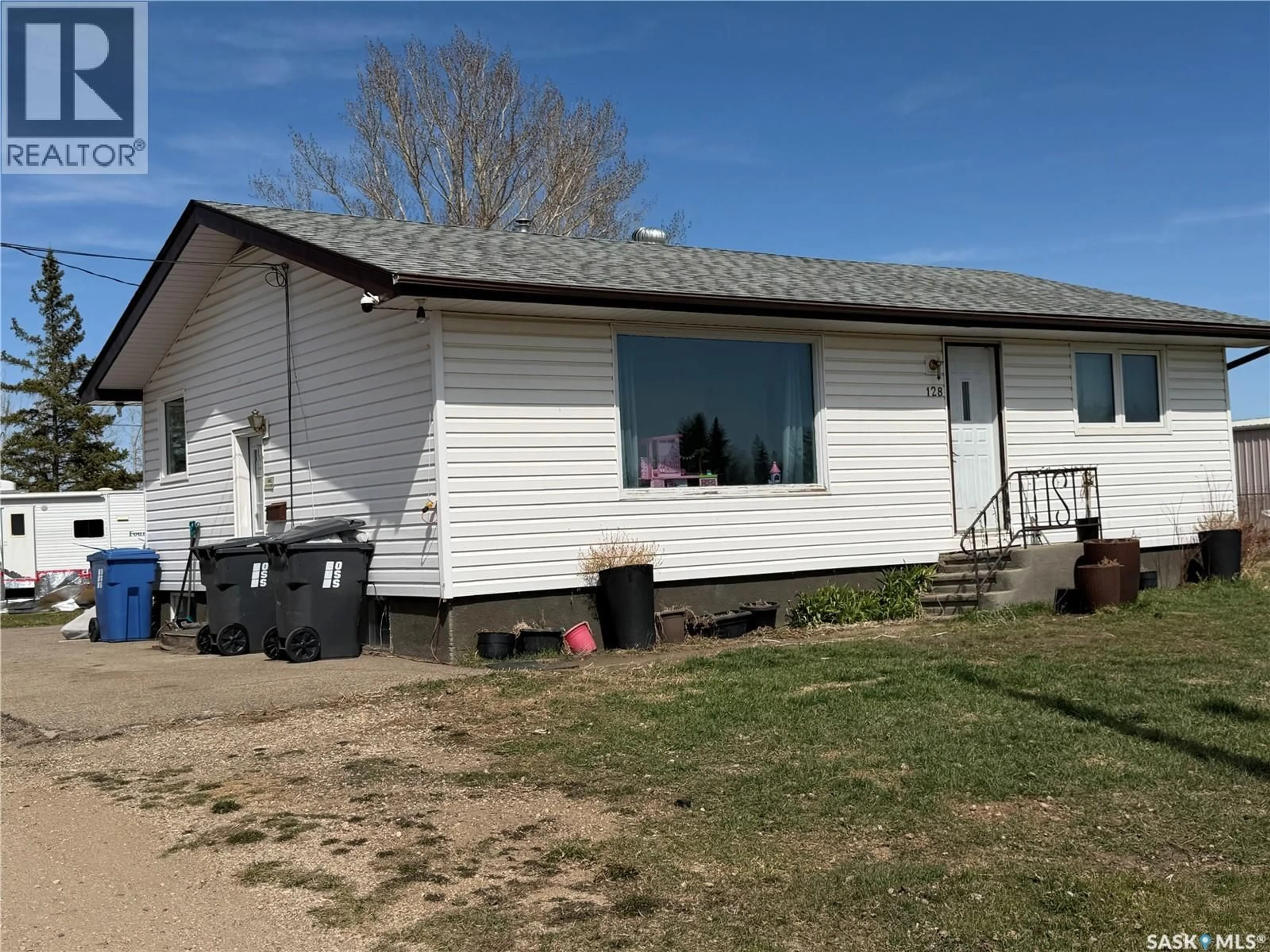 A pic from outside/outdoor area/front of a property/back of a property/a pic from drone, building for 128 9TH AVENUE, Melville Saskatchewan S0A2P0