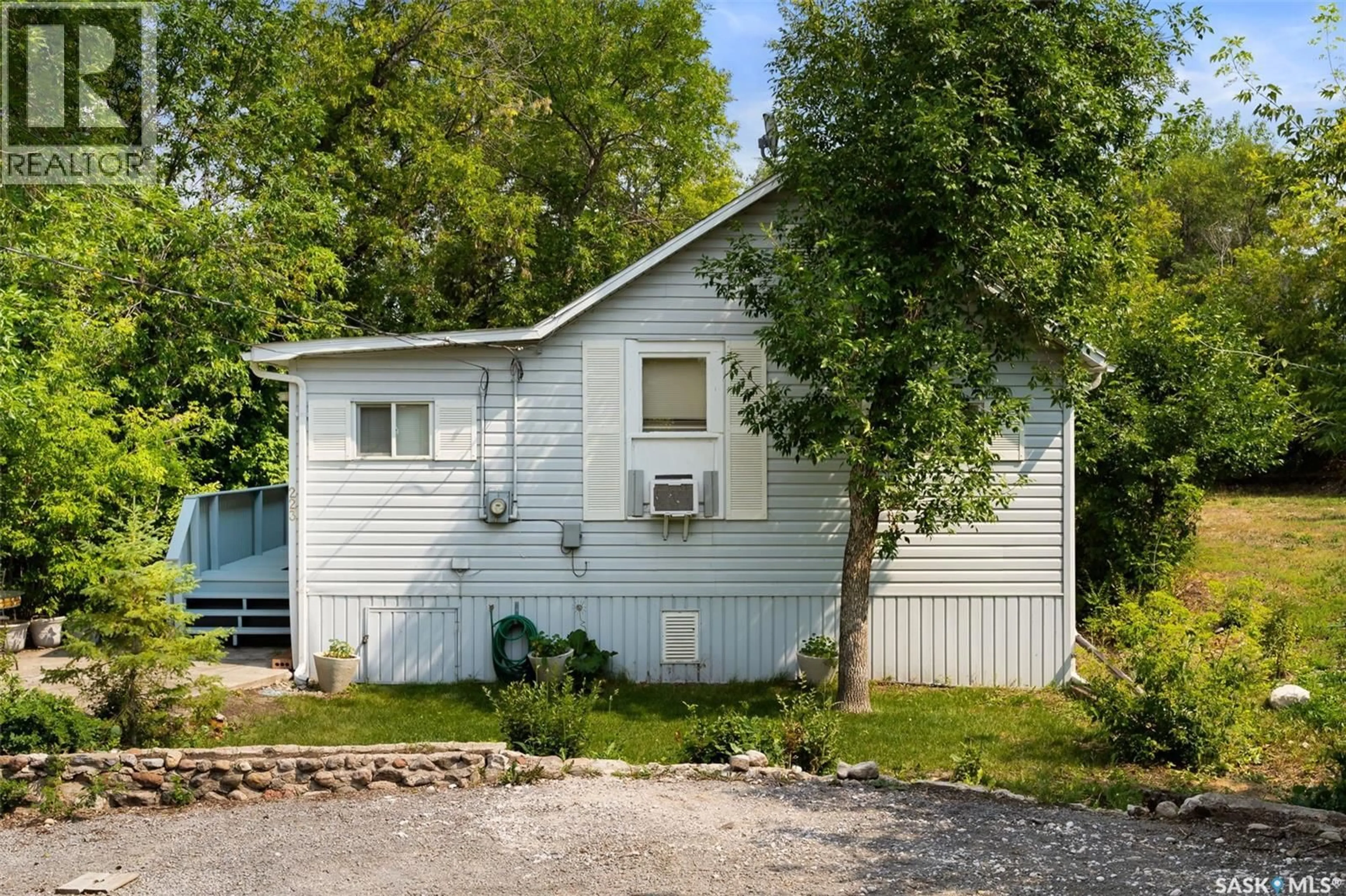 Home with vinyl exterior material, street for 223 2ND STREET, Regina Beach Saskatchewan S0G4C0