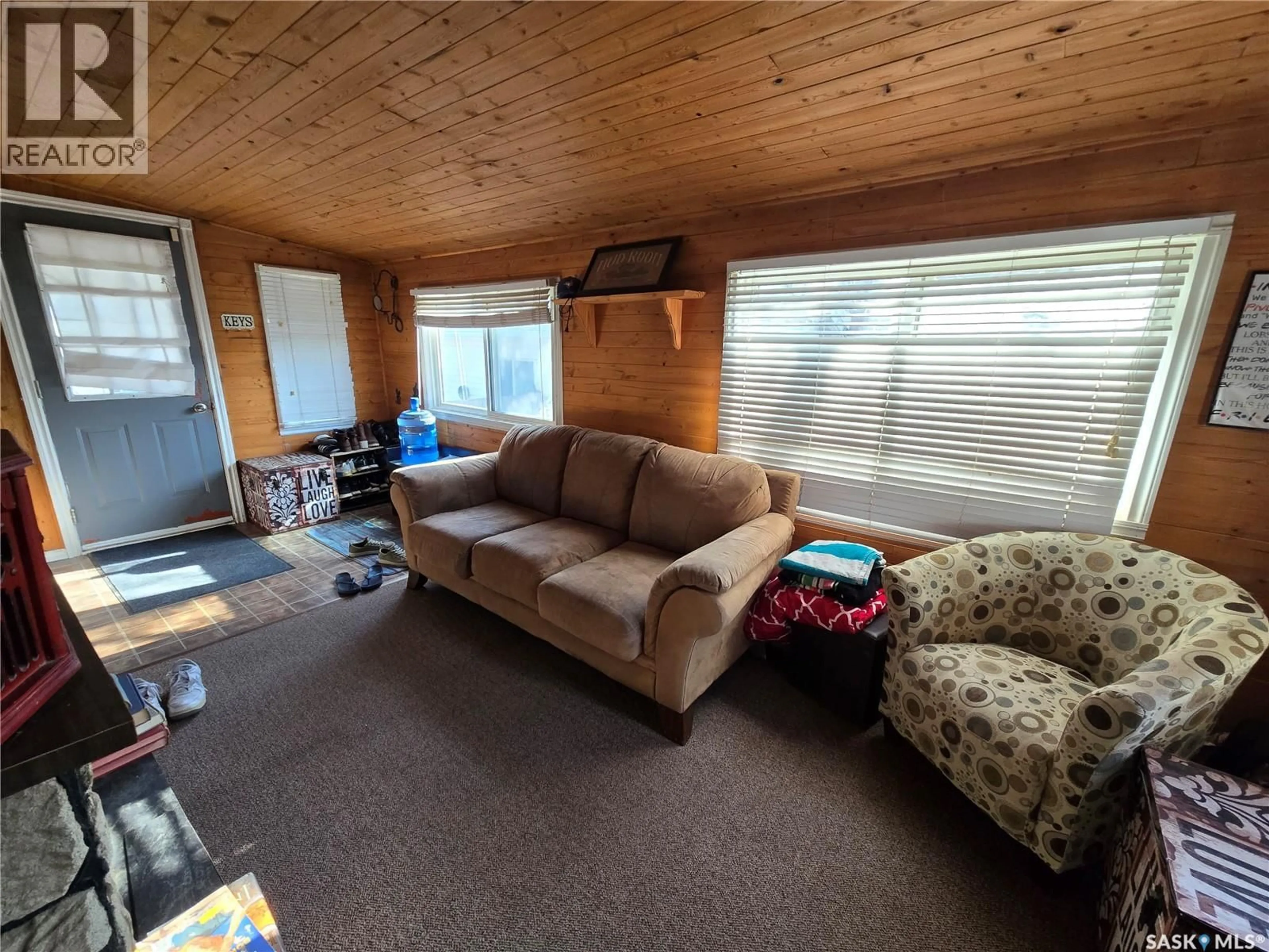 Living room with furniture, wood/laminate floor for 38 PRAIRIE SUN COURT, Swift Current Saskatchewan S9H3X3