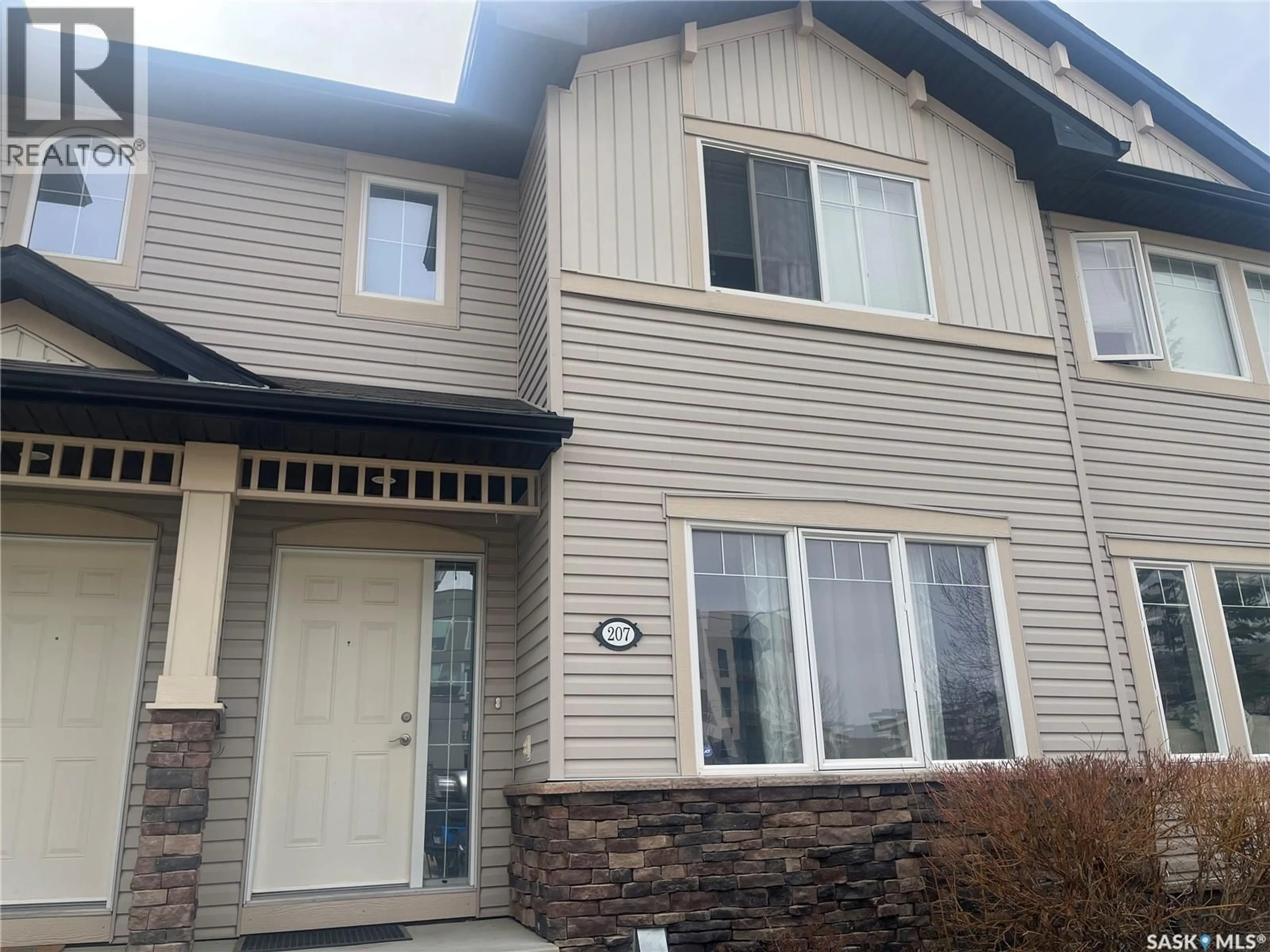 Home with vinyl exterior material, street for 207 - 303 SLIMMON PLACE, Saskatoon Saskatchewan S7V0A8