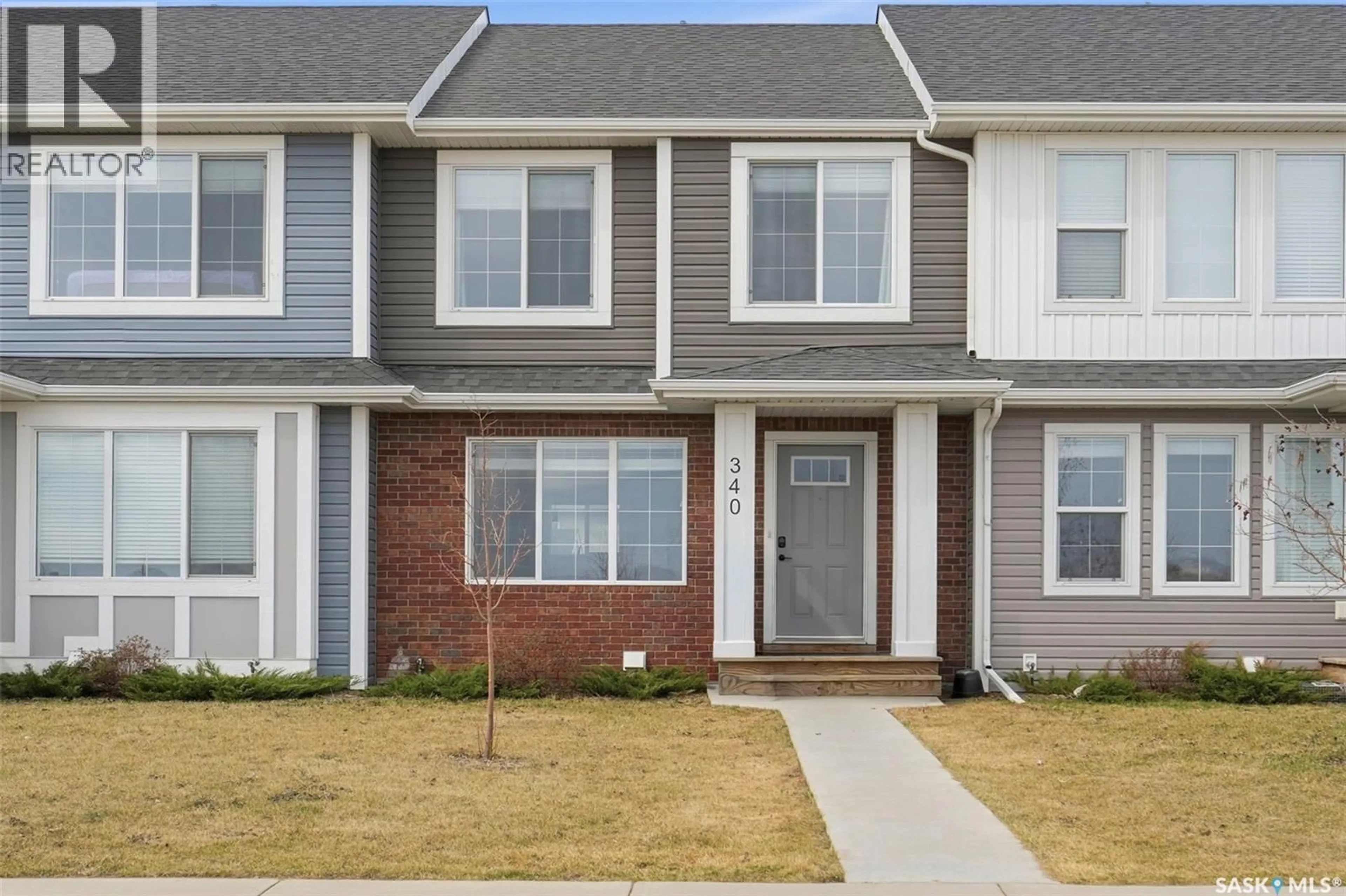 Home with brick exterior material, street for 340 MCORMOND DRIVE, Saskatoon Saskatchewan S7V0W9