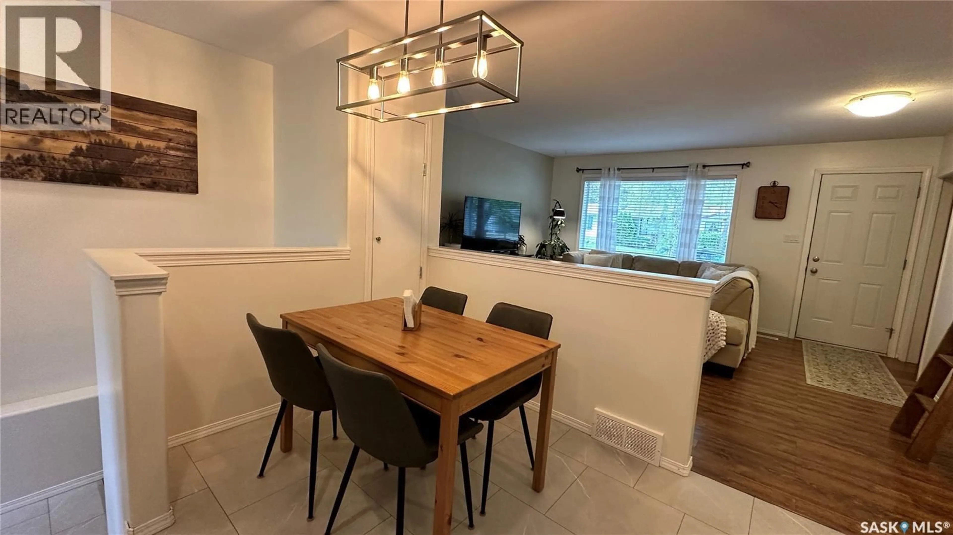 Dining room, wood/laminate floor for 807 107TH AVENUE, Tisdale Saskatchewan S0E1T0