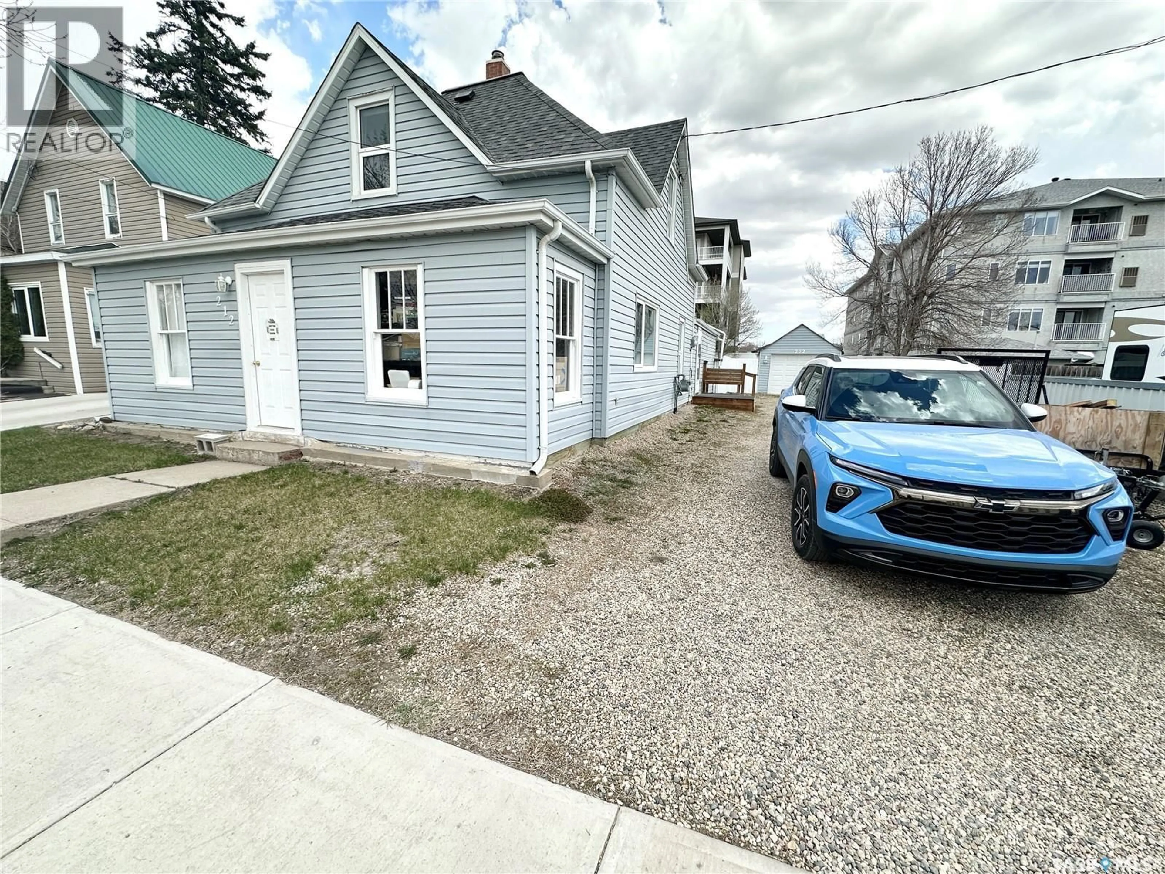 A pic from outside/outdoor area/front of a property/back of a property/a pic from drone, street for 212 FOSTER STREET, Weyburn Saskatchewan S4H0R1