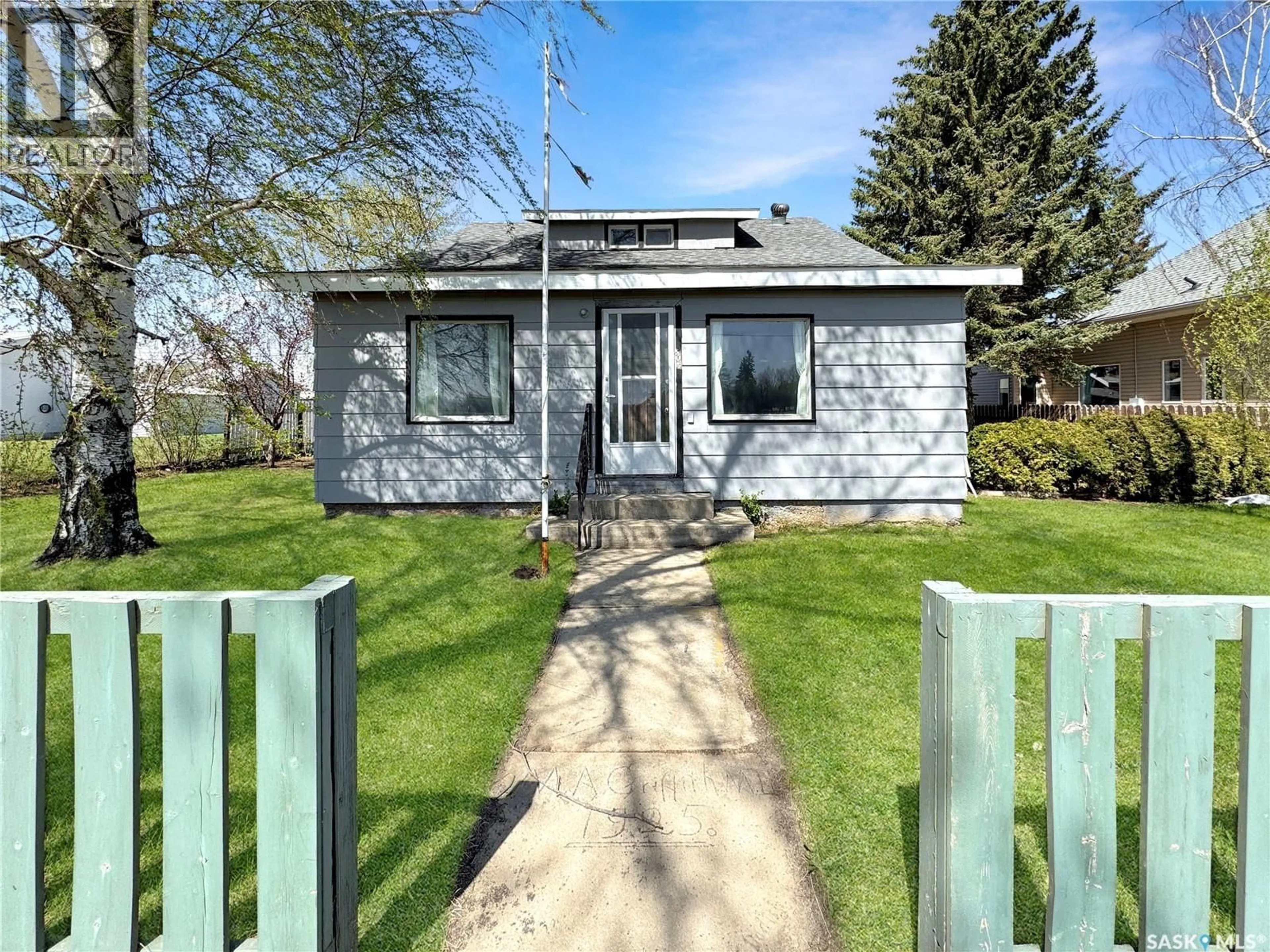Home with vinyl exterior material, street for 405 RAILWAY AVENUE, Cut Knife Saskatchewan S0M0N0