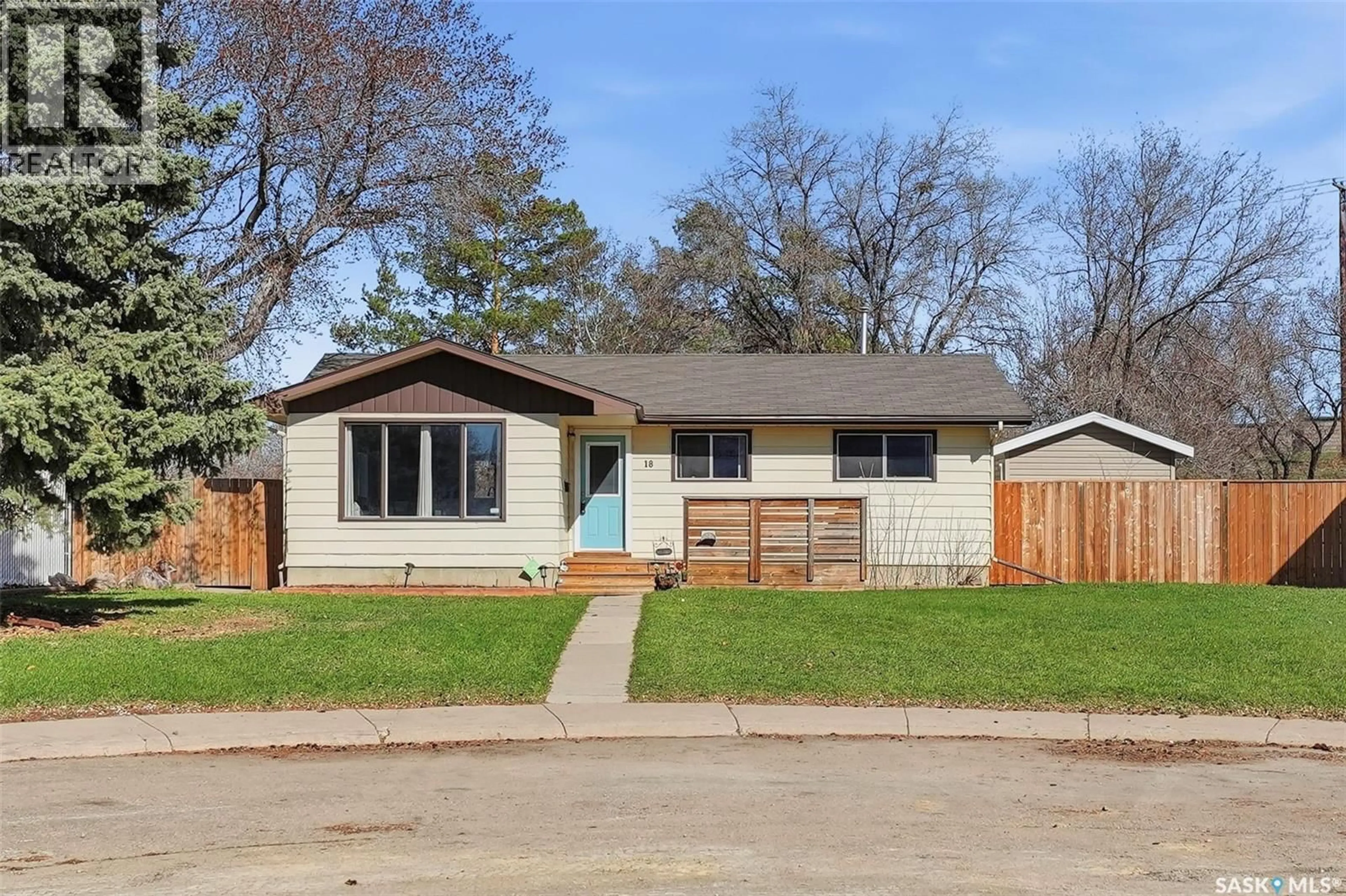 Home with vinyl exterior material, street for 18 MACKIE CRESCENT, Saskatoon Saskatchewan S7L3V3