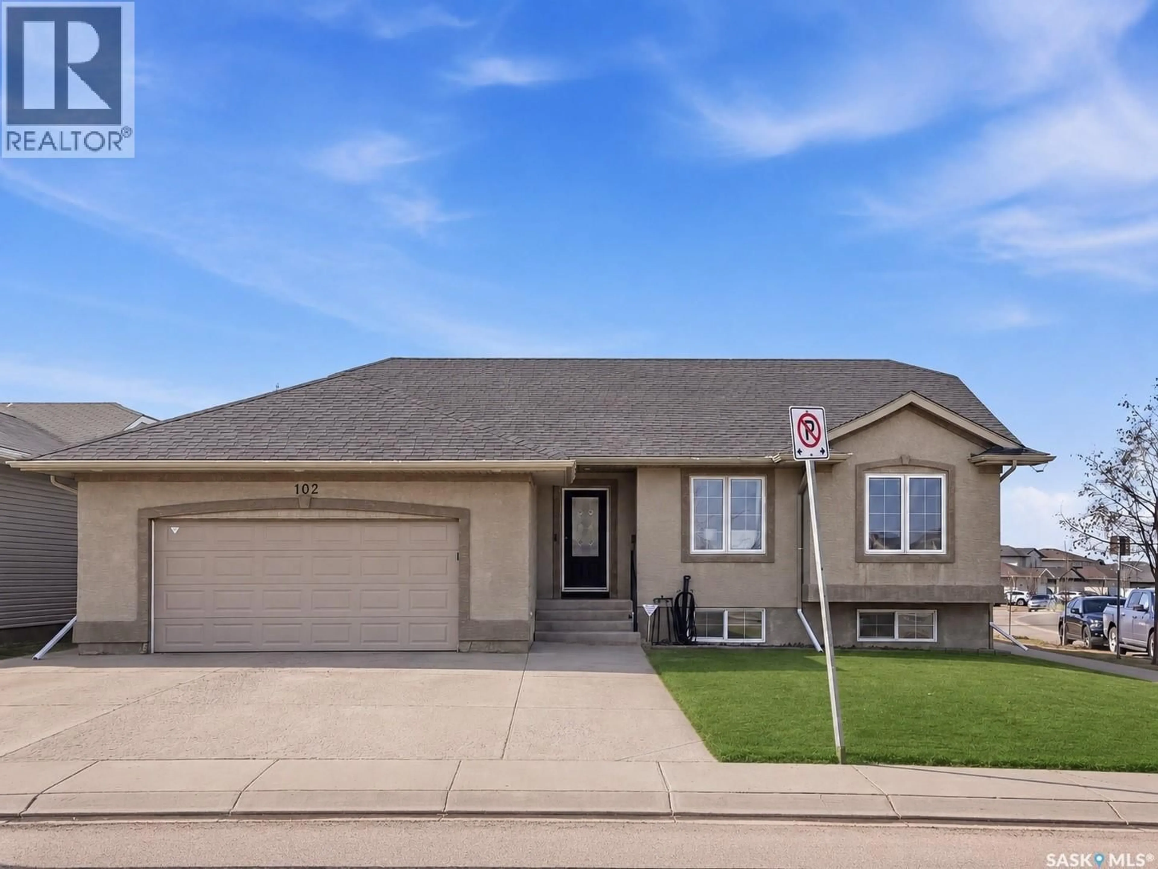 Home with vinyl exterior material, street for 102 KEEDWELL STREET, Saskatoon Saskatchewan S7W1B4
