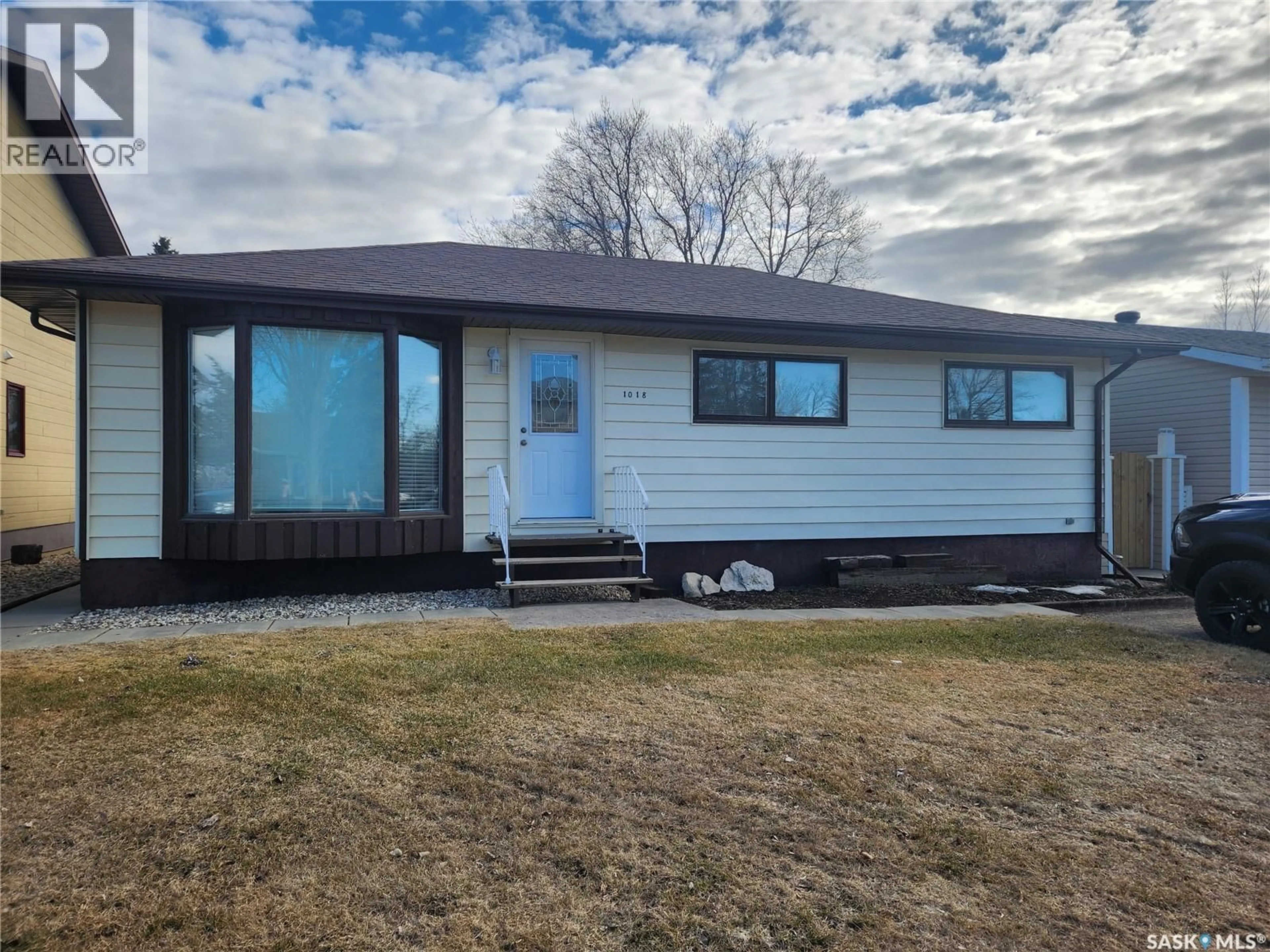Home with vinyl exterior material, street for 1018 108TH AVENUE, Tisdale Saskatchewan S0E1T0